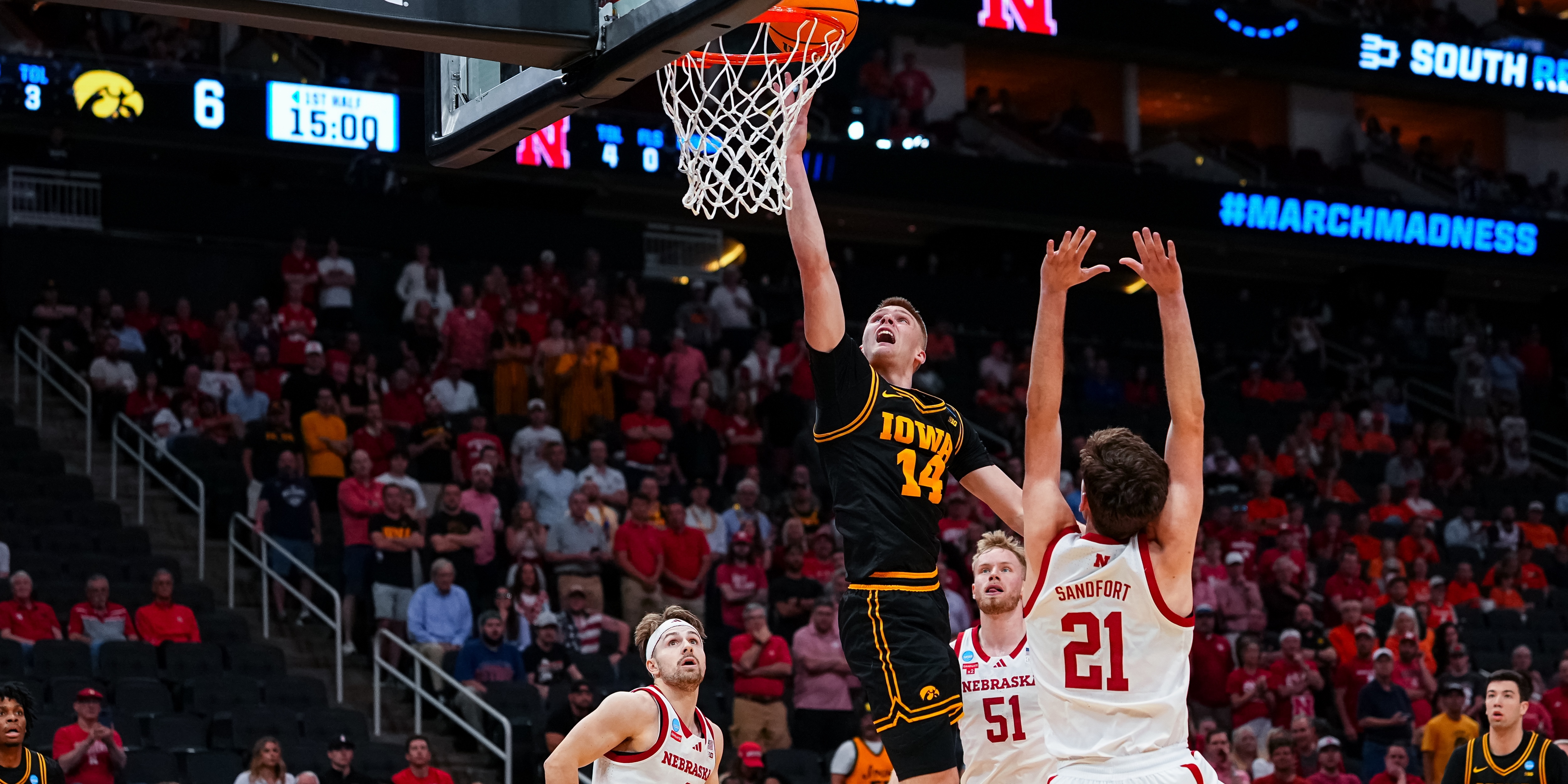Iowa guard Bennett Stirtz shoots the basketball over Nebraska forward Pryce Sandfort