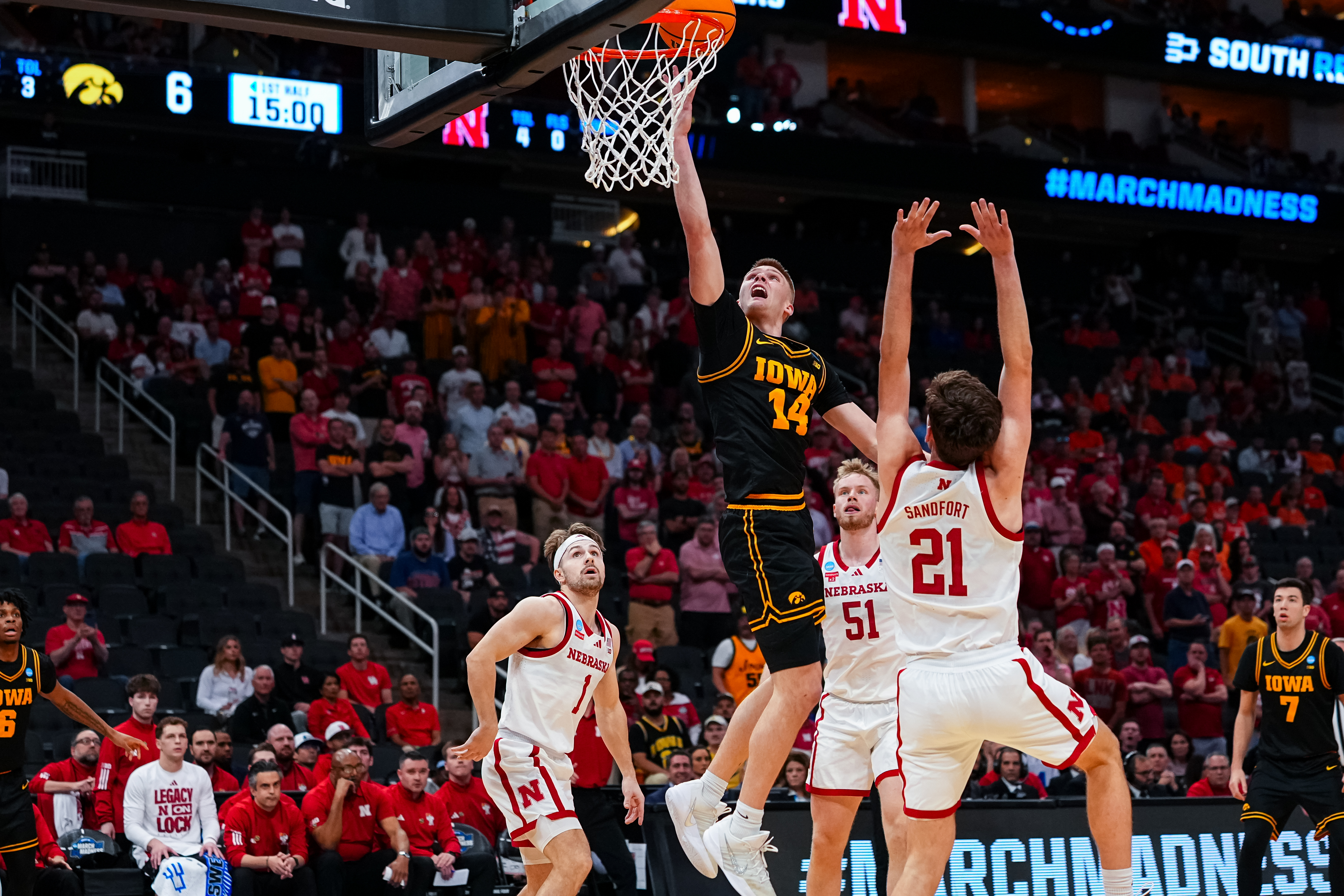 Iowa guard Bennett Stirtz shoots the basketball over Nebraska forward Pryce Sandfort