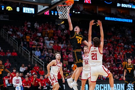 Iowa guard Bennett Stirtz shoots the basketball over Nebraska forward Pryce Sandfort