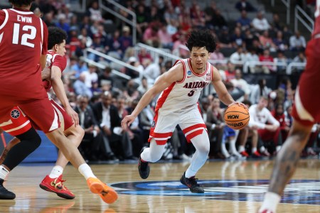 Arizona guard Brayden Burries sidesteps an Arkansas defender