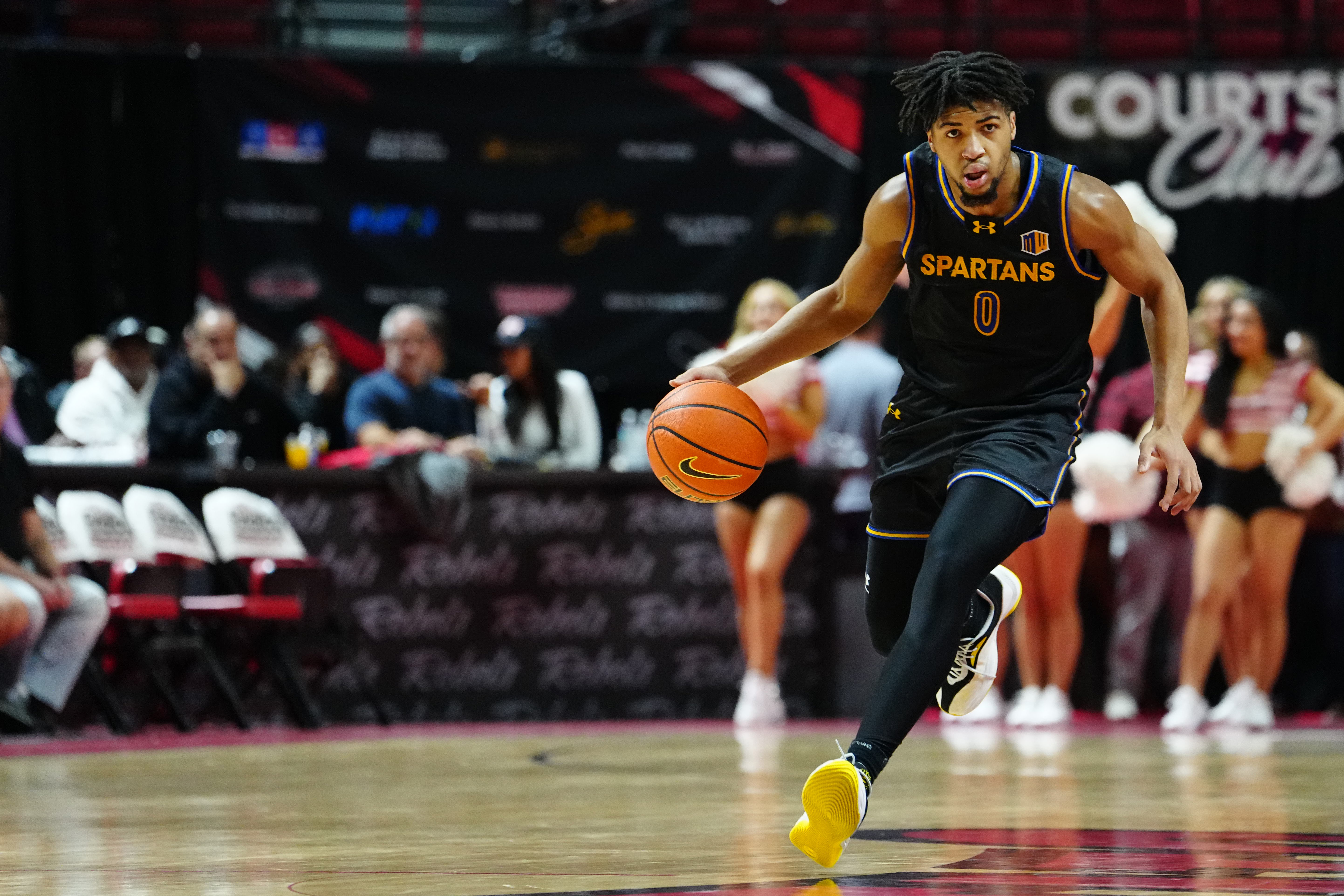 Colby Garland of the San Jose State Spartans brings the ball up court.