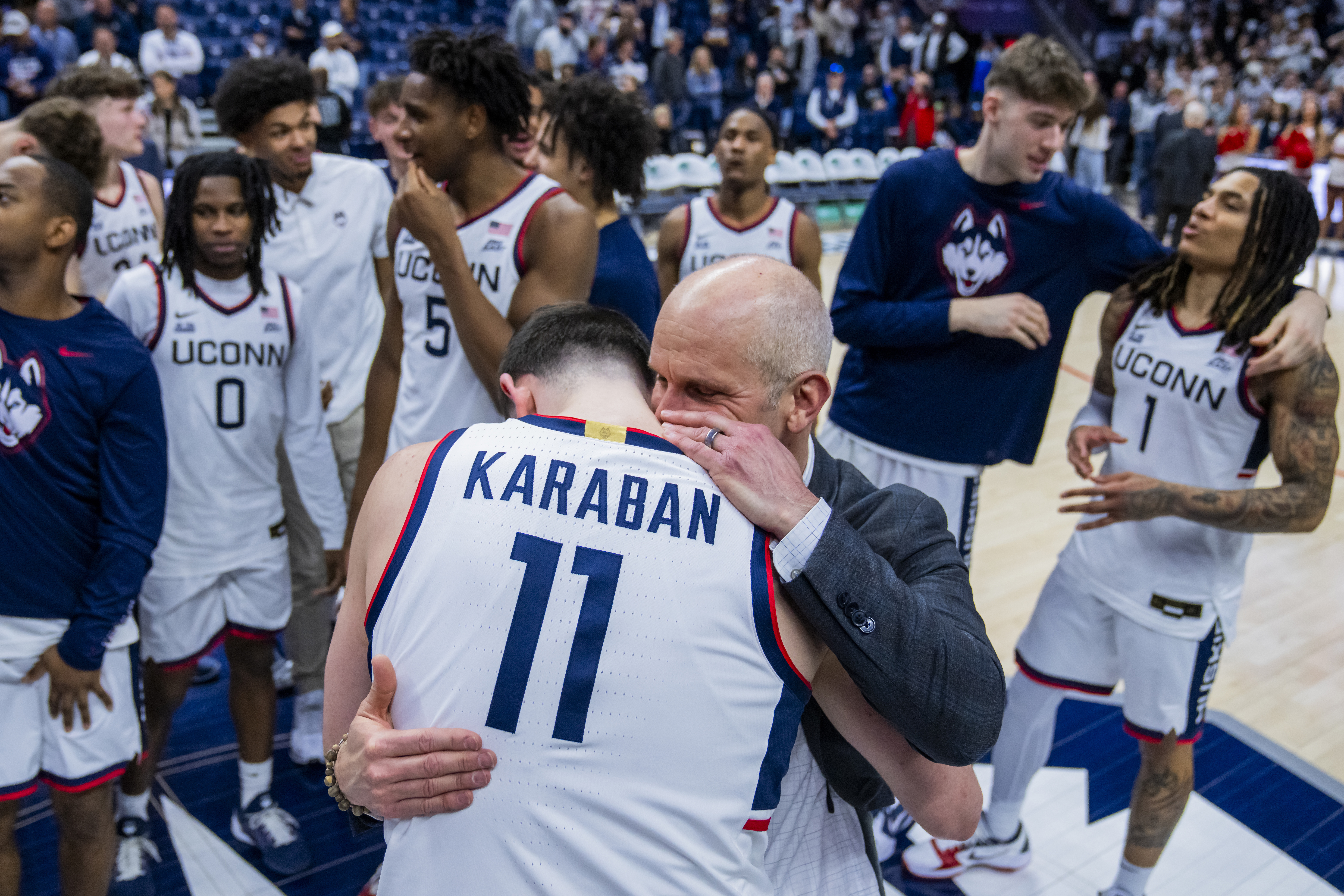 Senior Alex Karaban embraces UConn head coach Dan Hurley after a win over Seton Hall