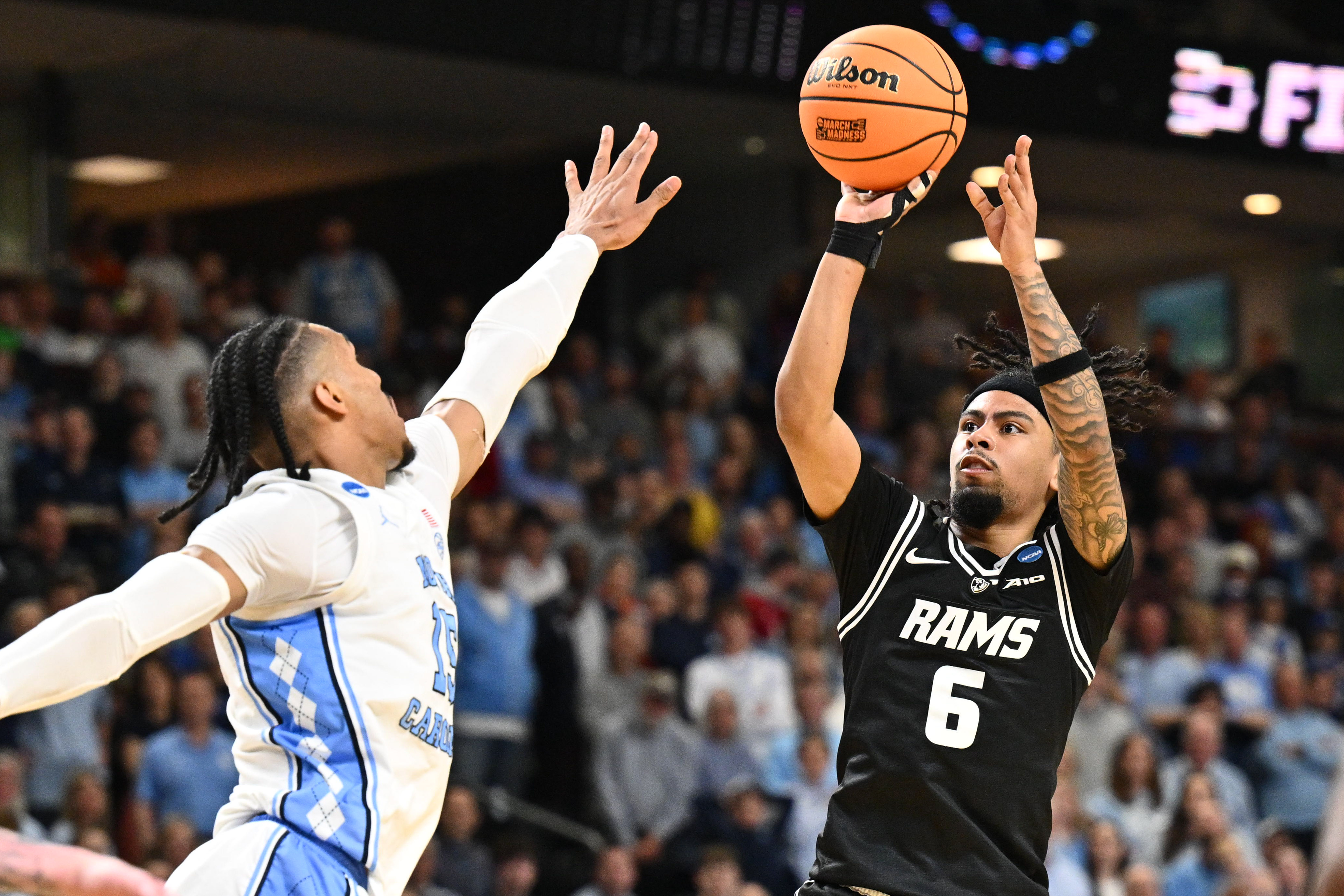 Hill, shown here shooting over UNC's Jarin Stevenson, exploded for 34 points to carry VCU to the second round