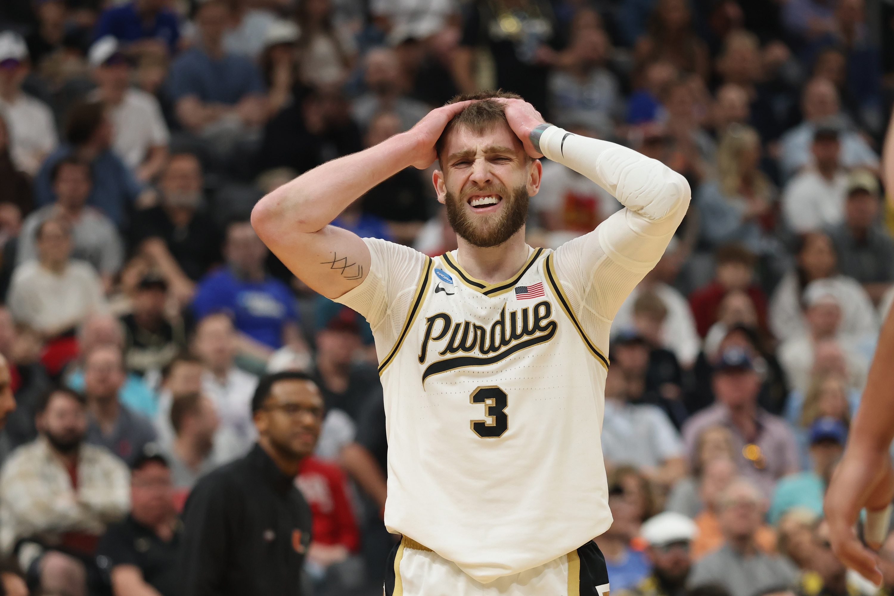 Purdue basketball player Braden Smith puts his hands on his head in frustration.