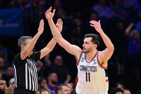 Senior Alex Karaban gestures to the crowd in Philadelphia after hitting a timely 3-pointer in the second half