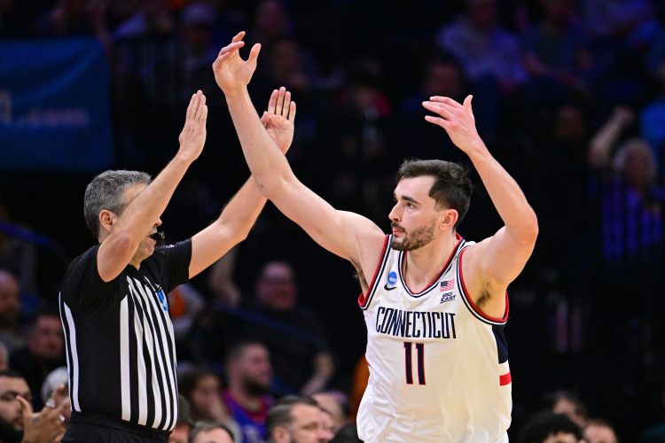 Senior Alex Karaban gestures to the crowd in Philadelphia after hitting a timely 3-pointer in the second half