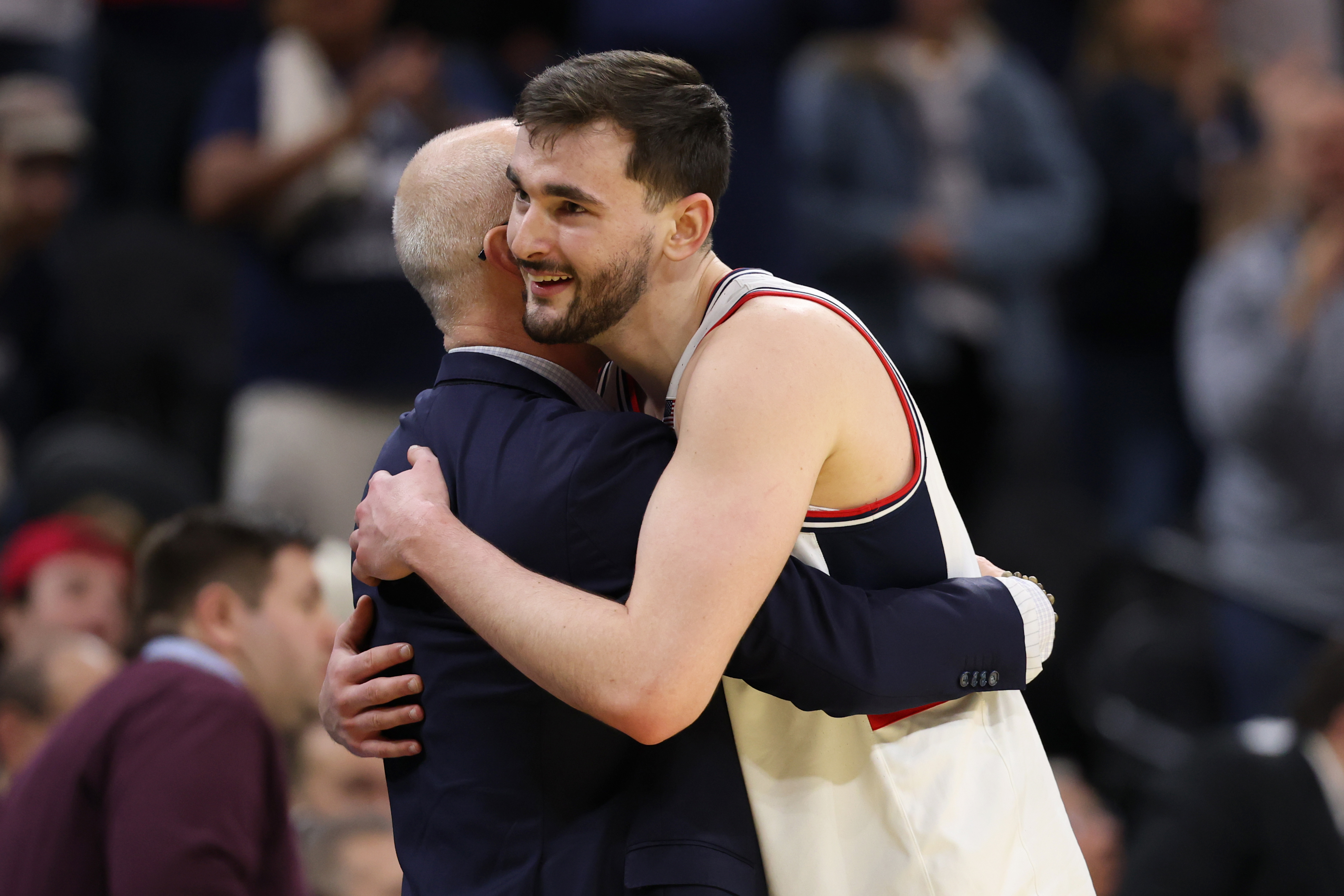Karaban embraces head coach Dan Hurley after securing a trip to the Sweet Sixteen