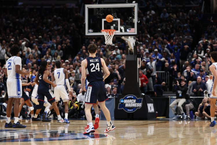 Braylon Mullins of the UConn Huskies hits the game winning shot with .04 seconds left against the Duke Blue Devils in the Elite Eight