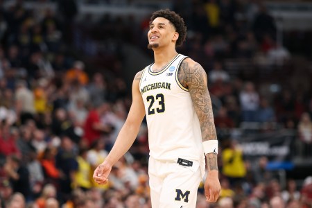 University of Michigan basketball player Yaxel Lendeborg smiles after a play