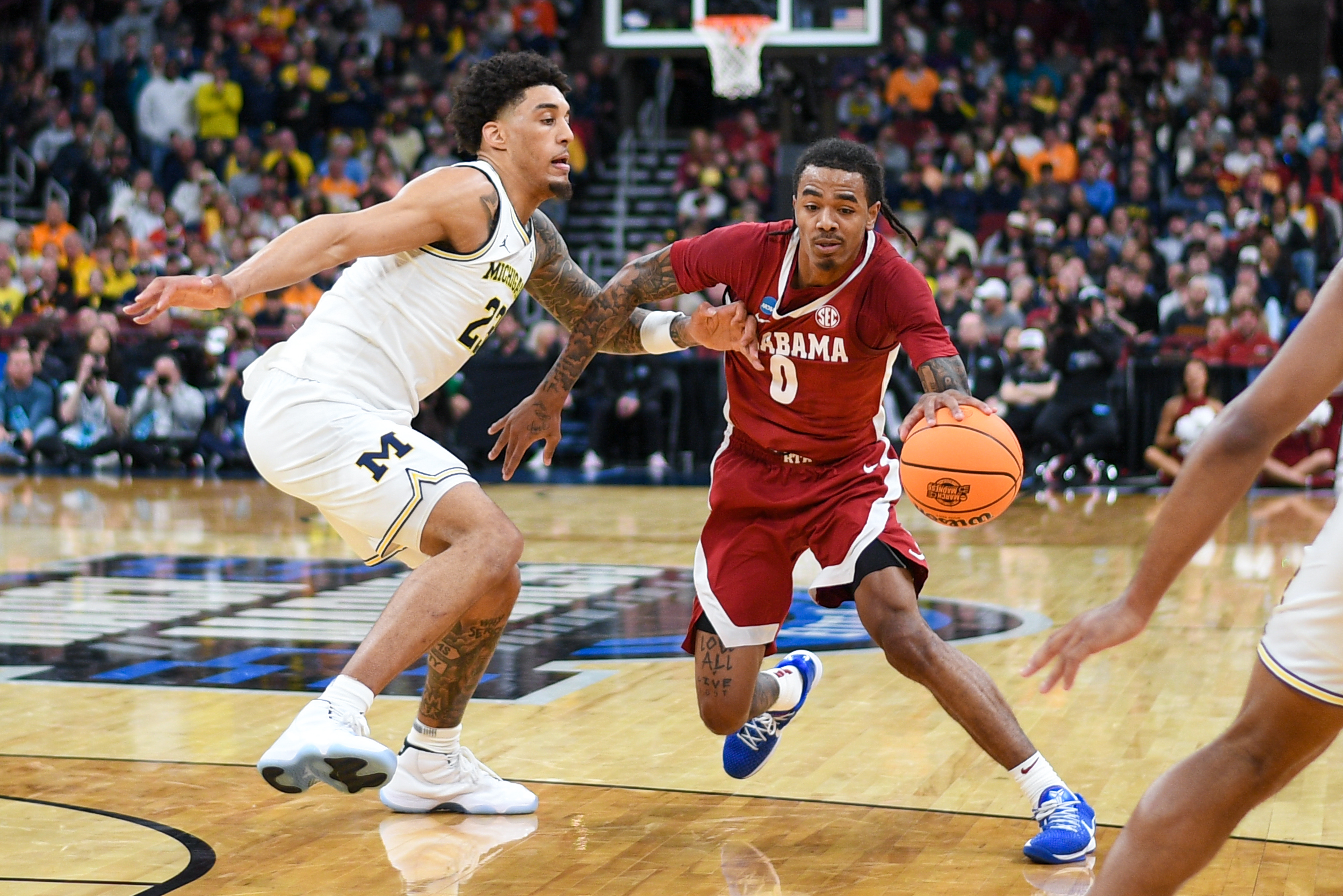 Alabama guard Labaron Philon drives against Michigan's Yaxel Lendeborg