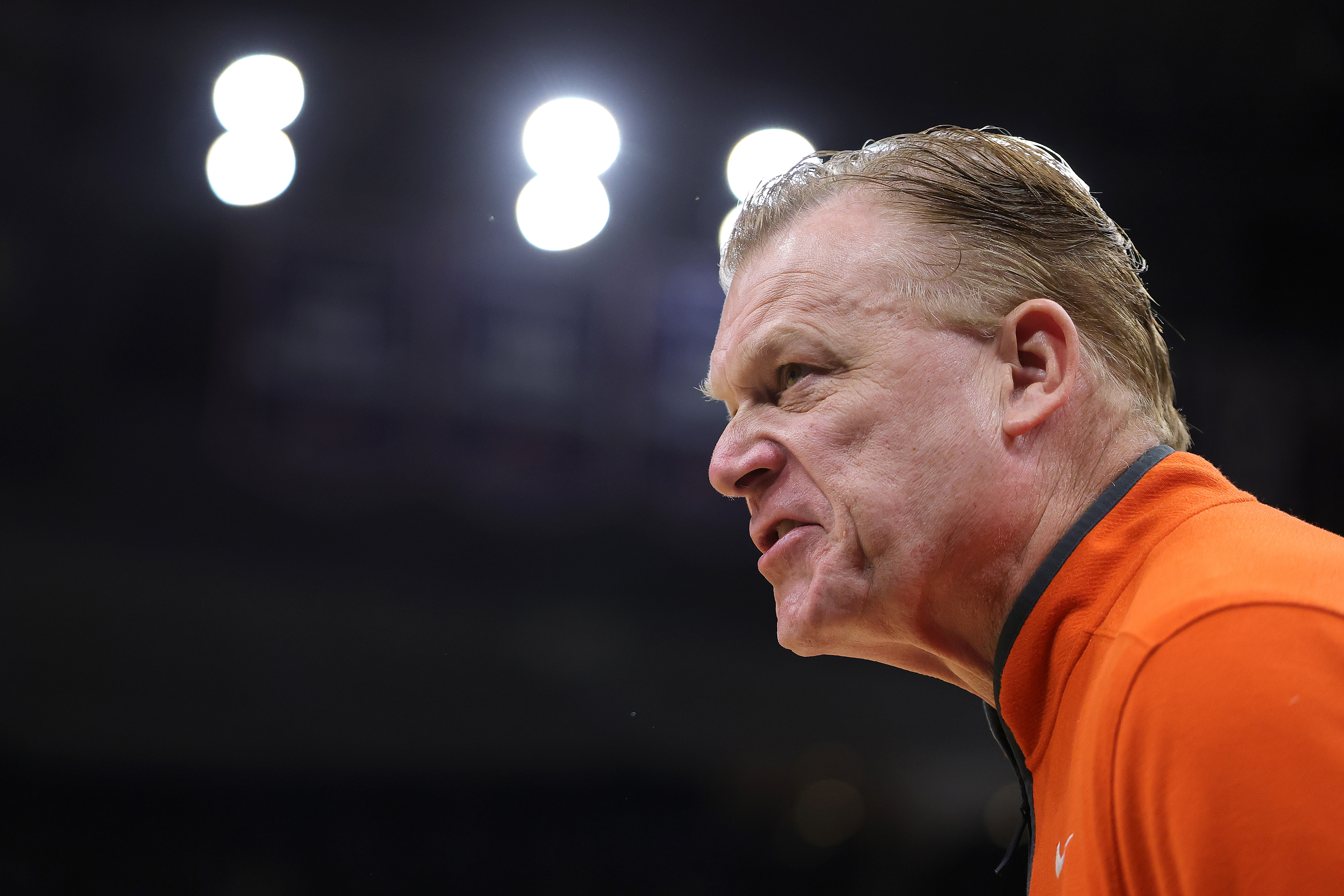 Illinois basketball coach Brad Underwood glares from the sideline