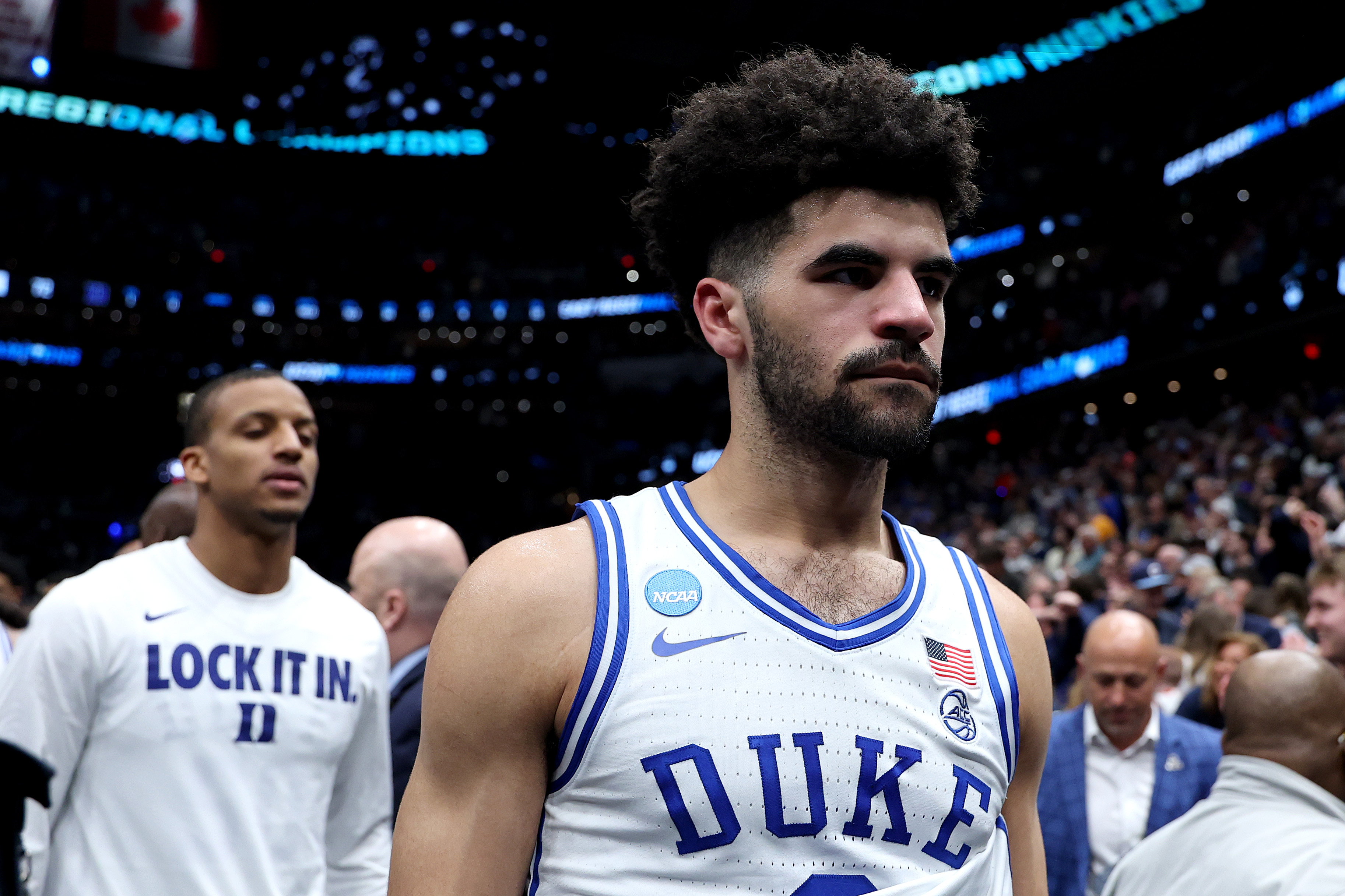 Cayden Boozer walking off the court following Duke's season-ending loss