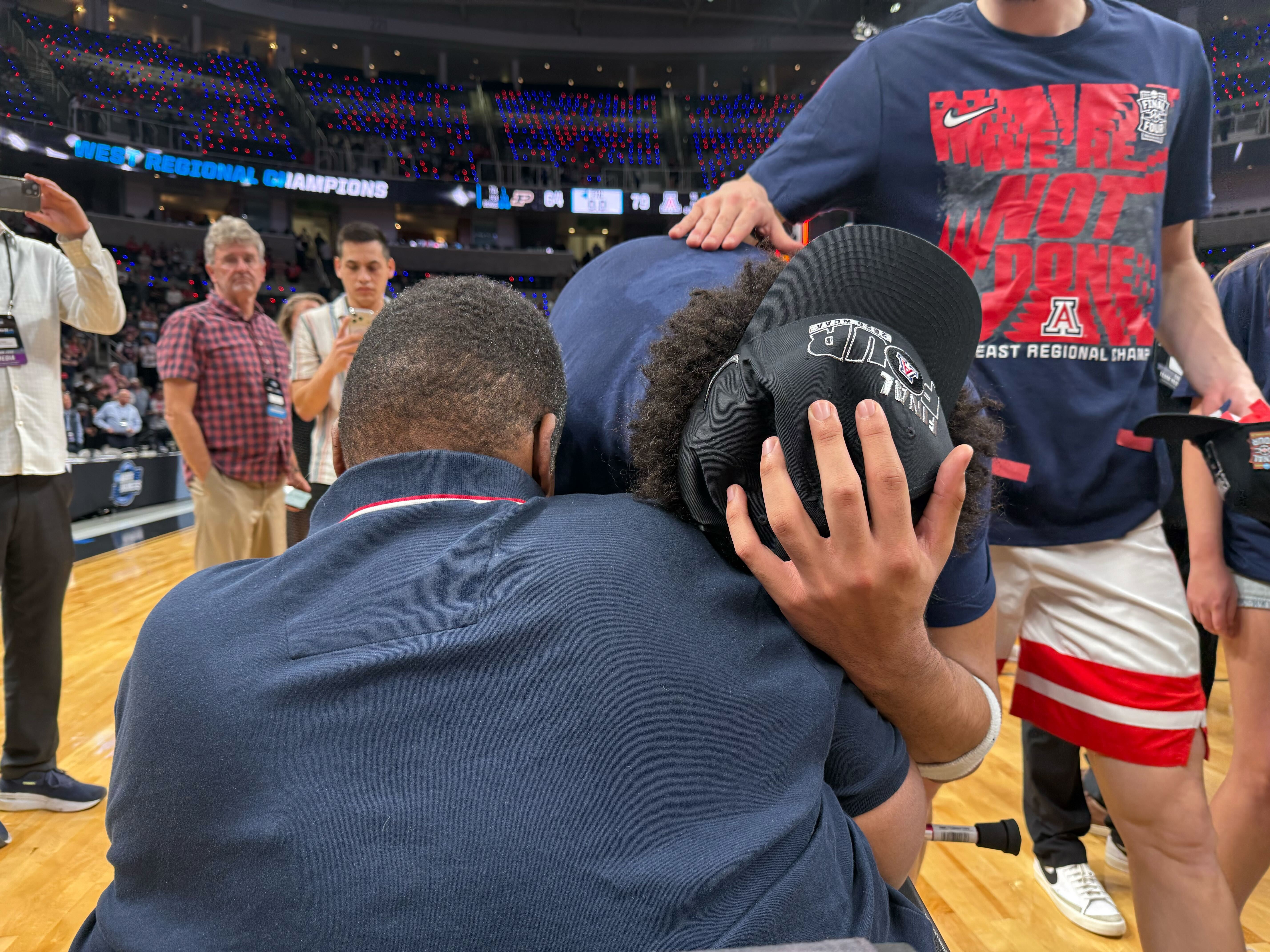 Koa Peat hugs his father after Arizona win