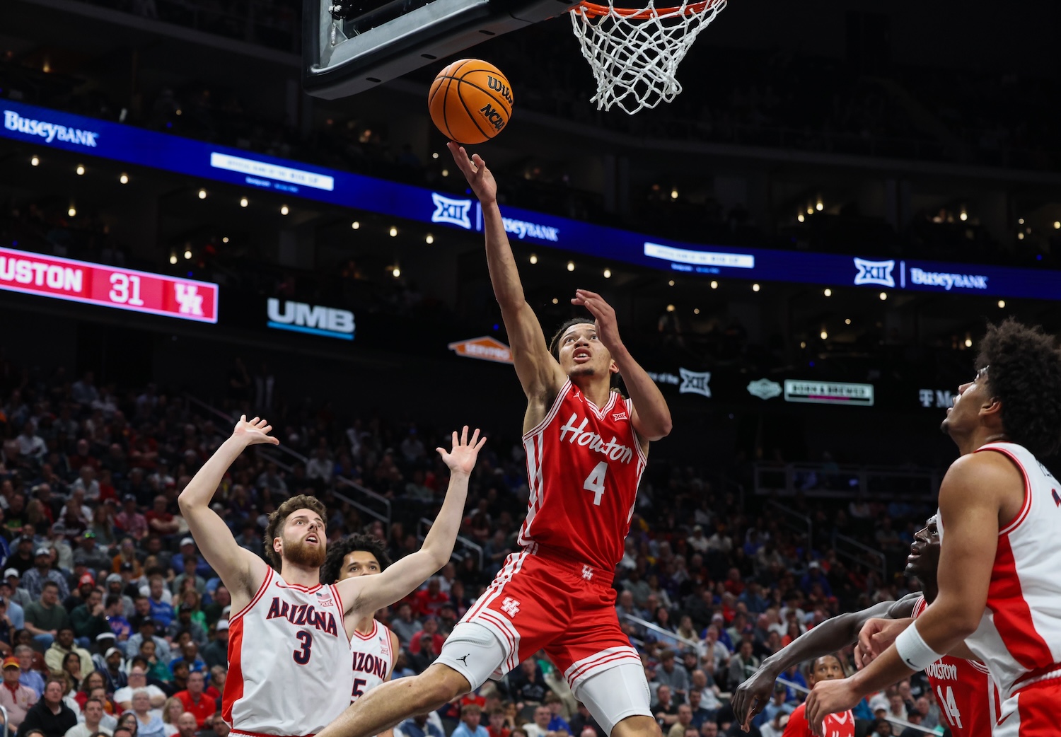 Kingston Flemings goes to the basket against Arizona Wildcats