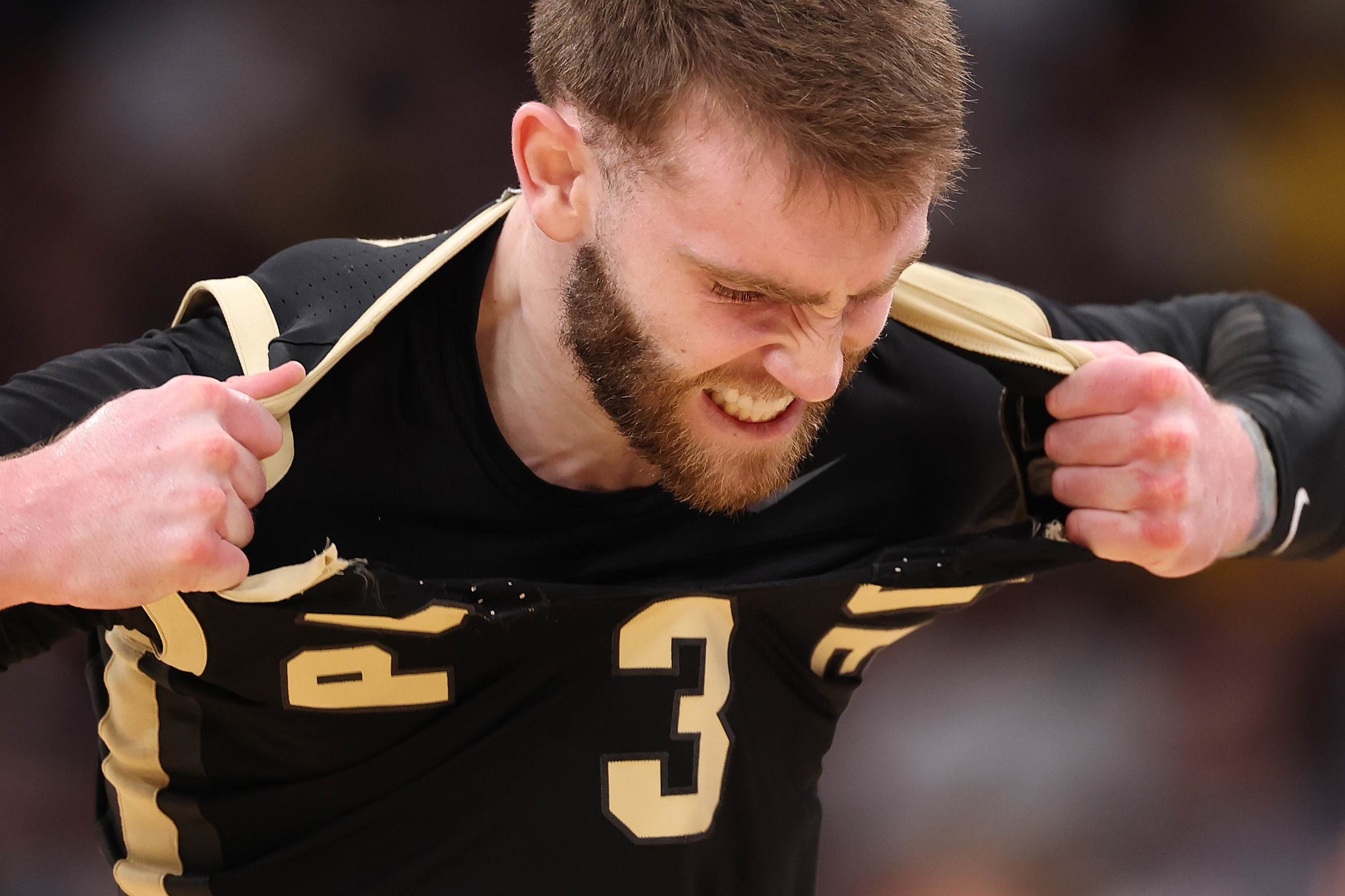 Boilermaker guard Braden Smith shreds his jersey in frustration. He wore #41 to close out the Big Ten Championship.
