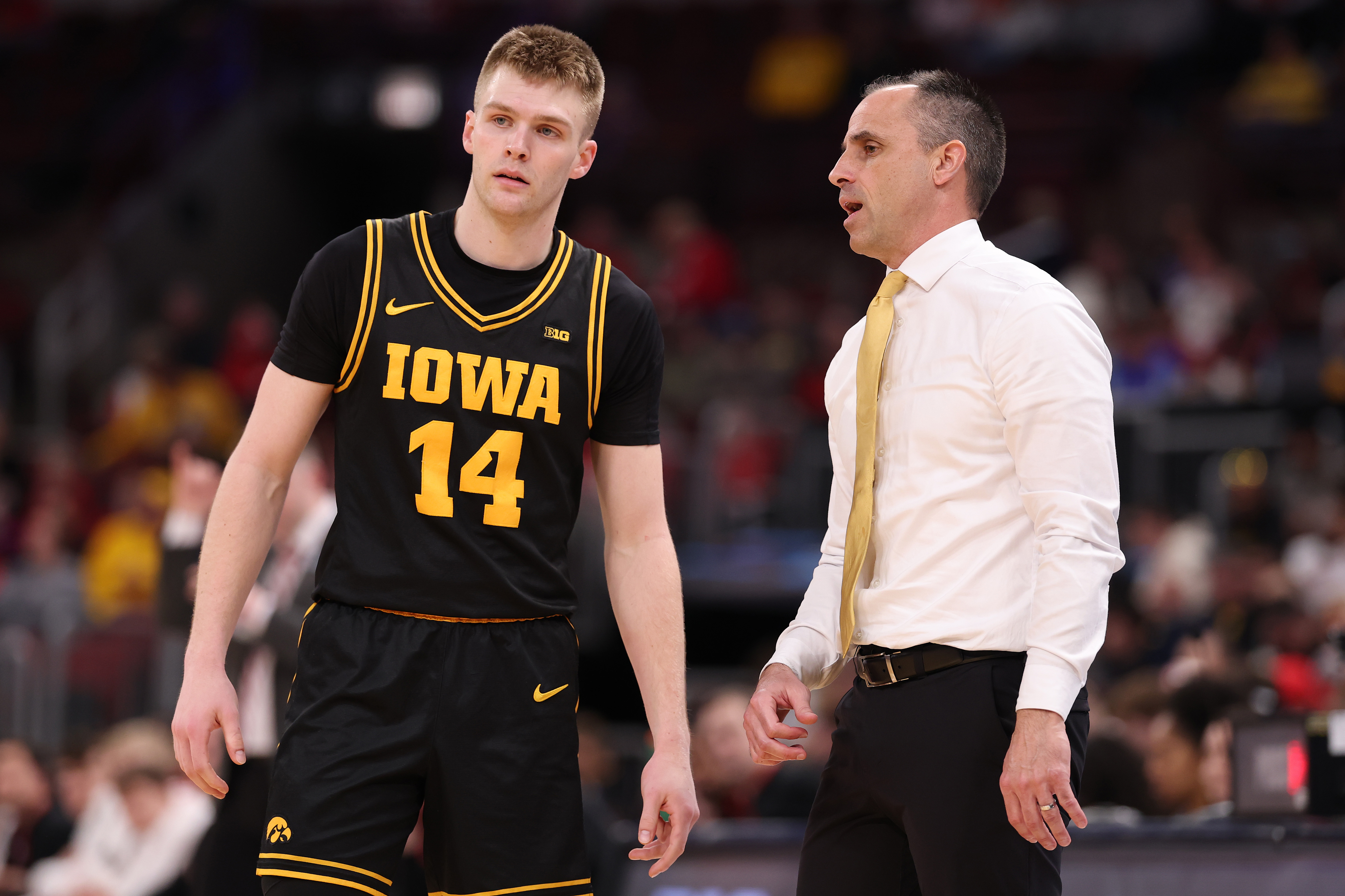 Bennett Stirtz speaks to Iowa coach Ben McCollum