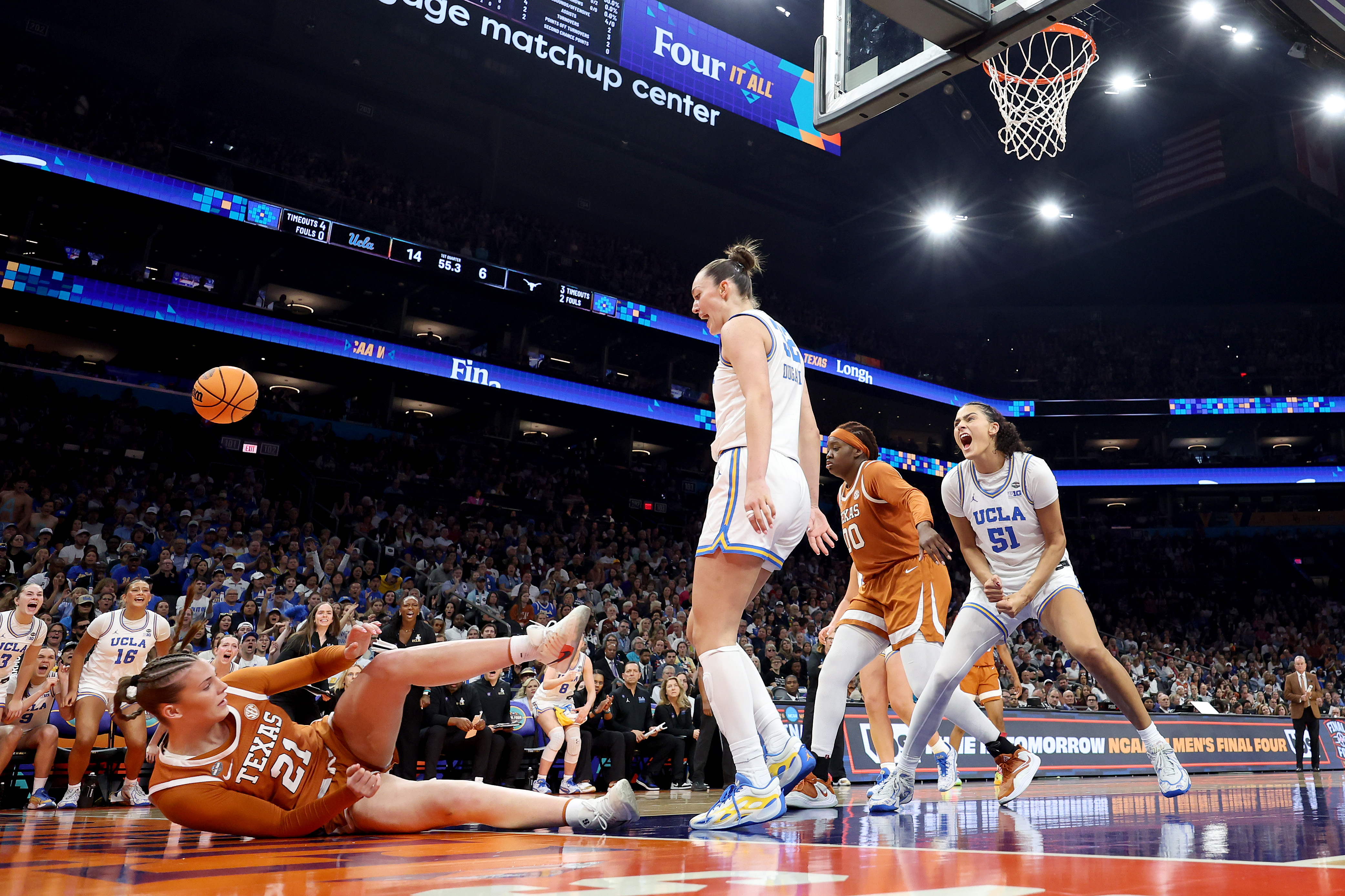 Lauren Betts and Angela Dugalić stand over Texas' Ashton Judd