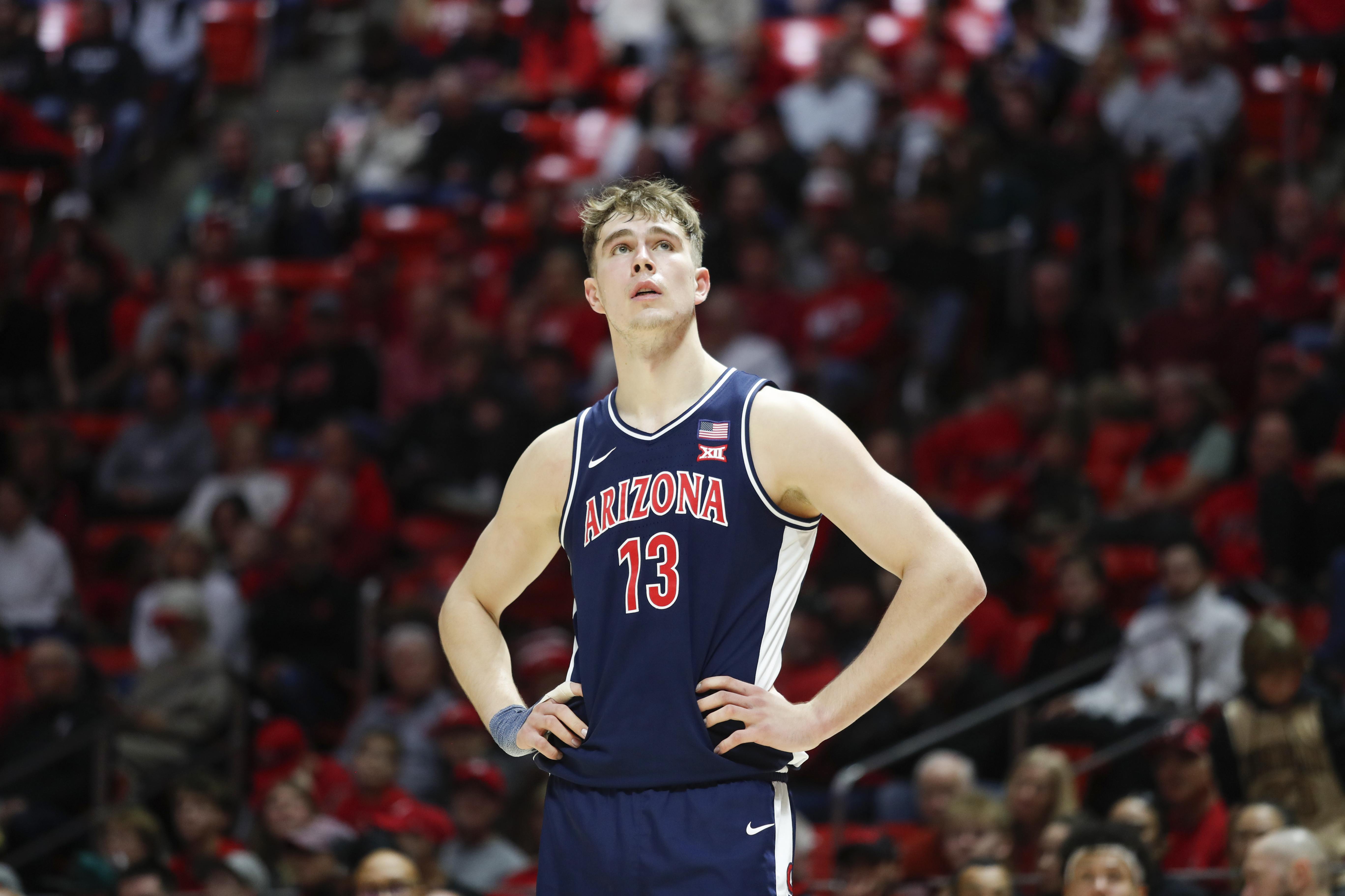Arizona big man Motiejus Krivas looks up at the scoreboard