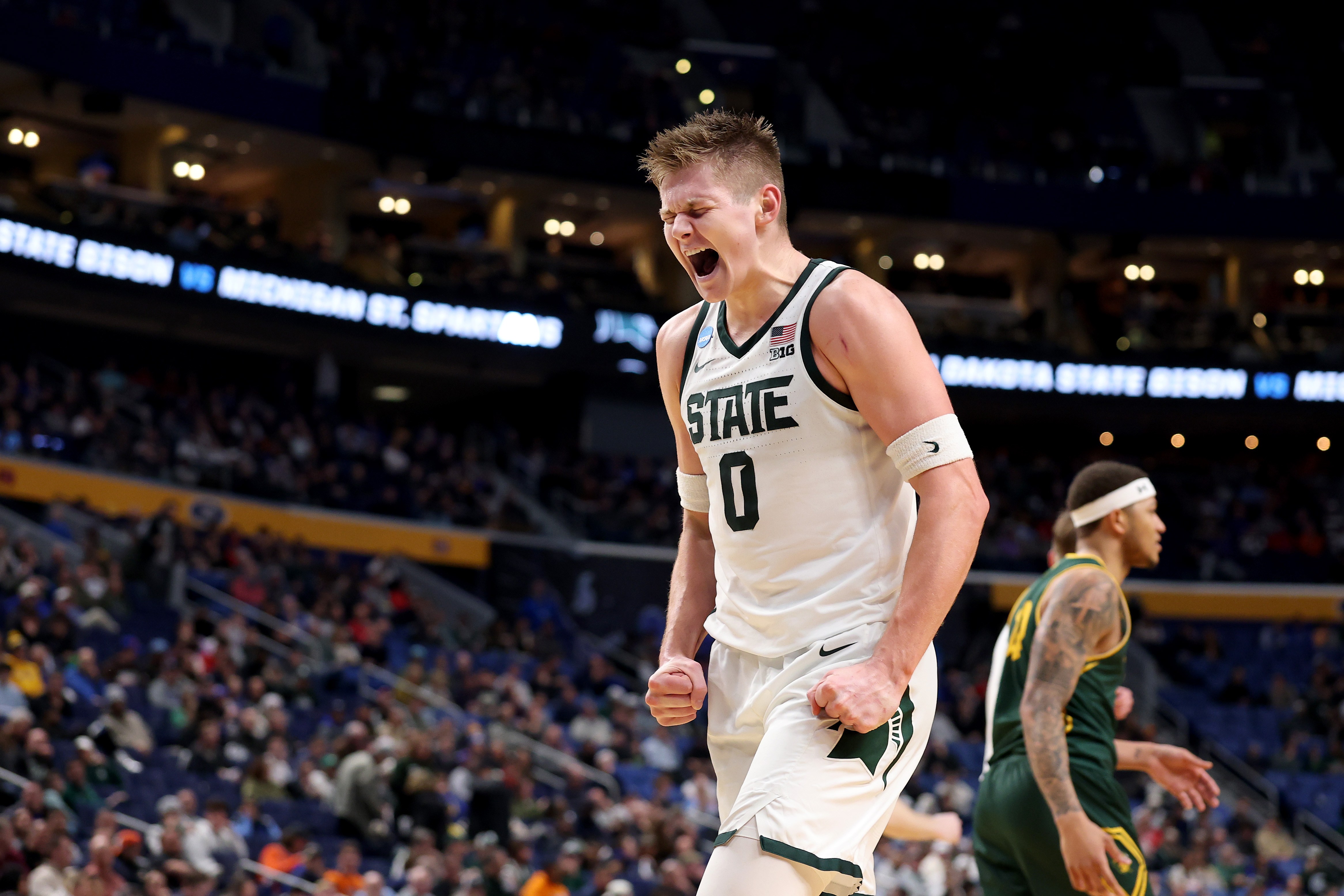 Jaxon Kohler fired up after making a basket for Michigan State