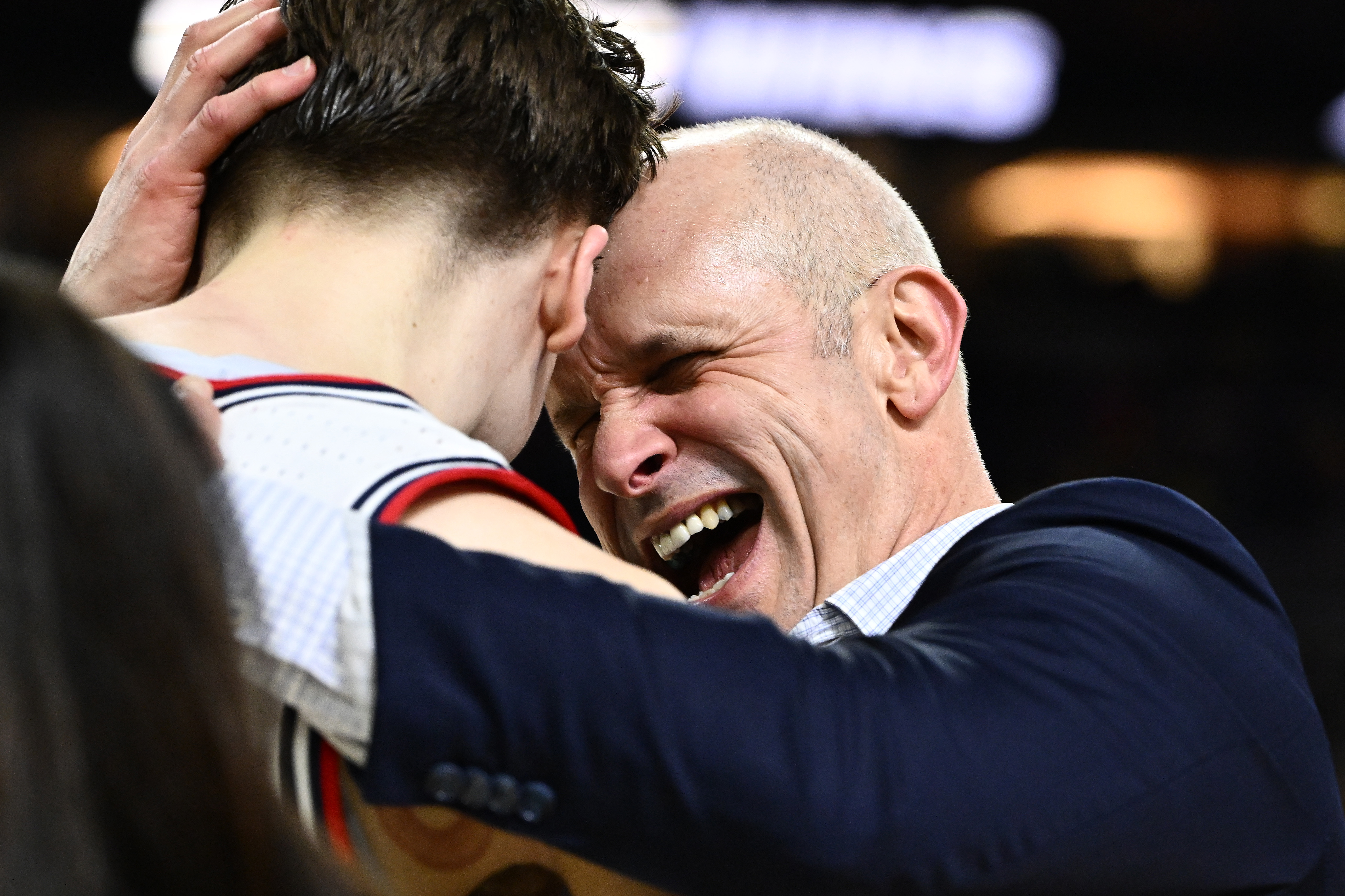 UConn coach Dan Hurley hugs player Braylon Mullins