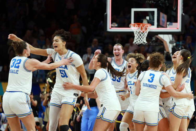Lauren Betts (#51), the tournament's Most Outstanding Player, celebrates with her teammates after upsetting South Carolina for a national title