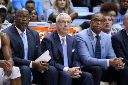 Former UNC head Roy Williams (center) and his successor Hubert Davis (right) back in 2017, when Davis was still an assistant