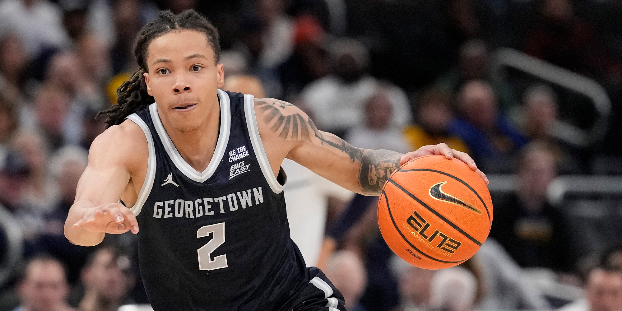 Georgetown basketball player Malik Mack dribbles the ball