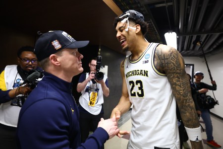 Dusty May and Yaxel Lendeborg celebrate after Michigan's Elite Eight win over Tennessee