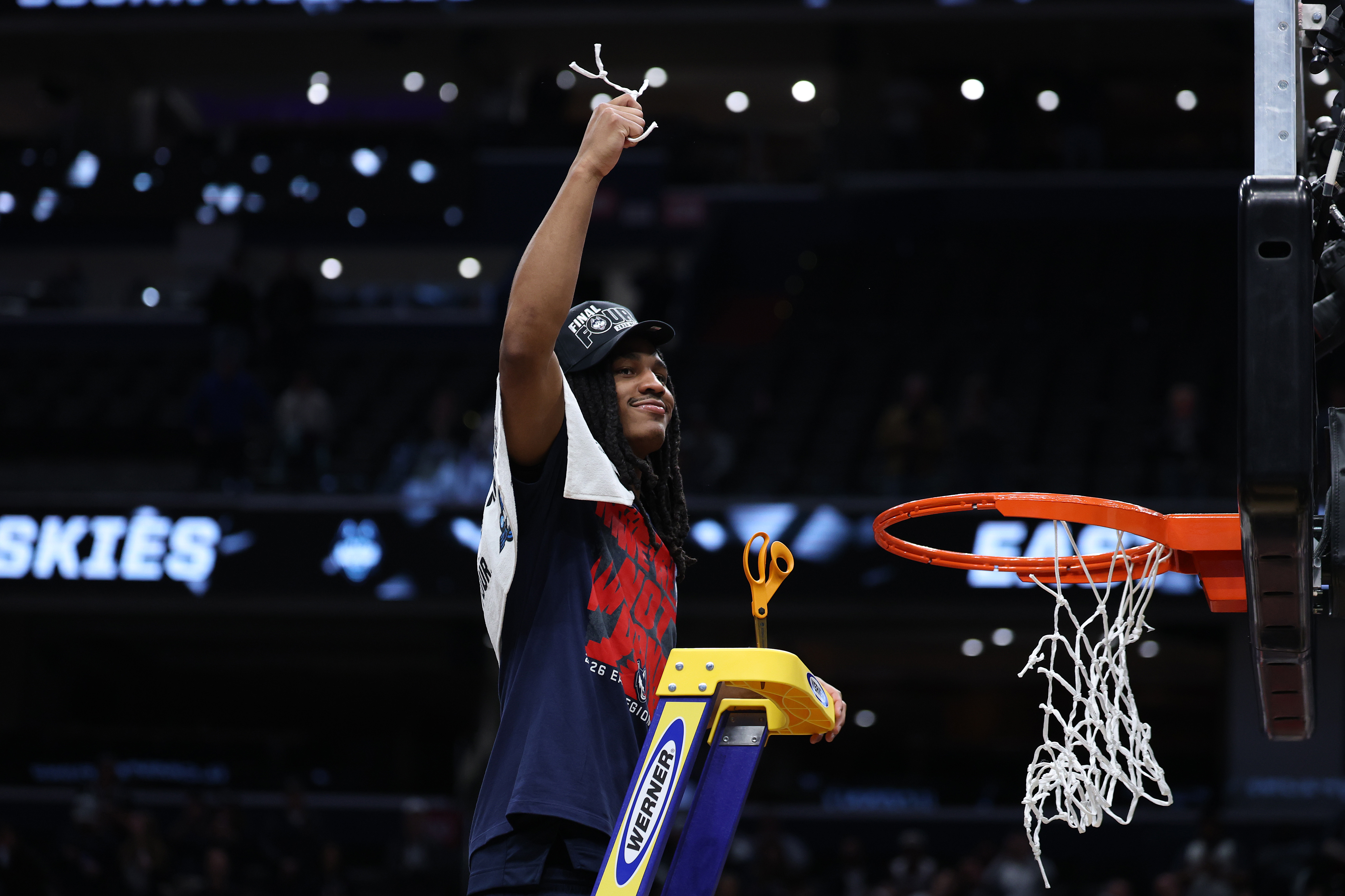 Demary Jr. cuts down the net in Washington DC after UConn's East Regional final win over Duke