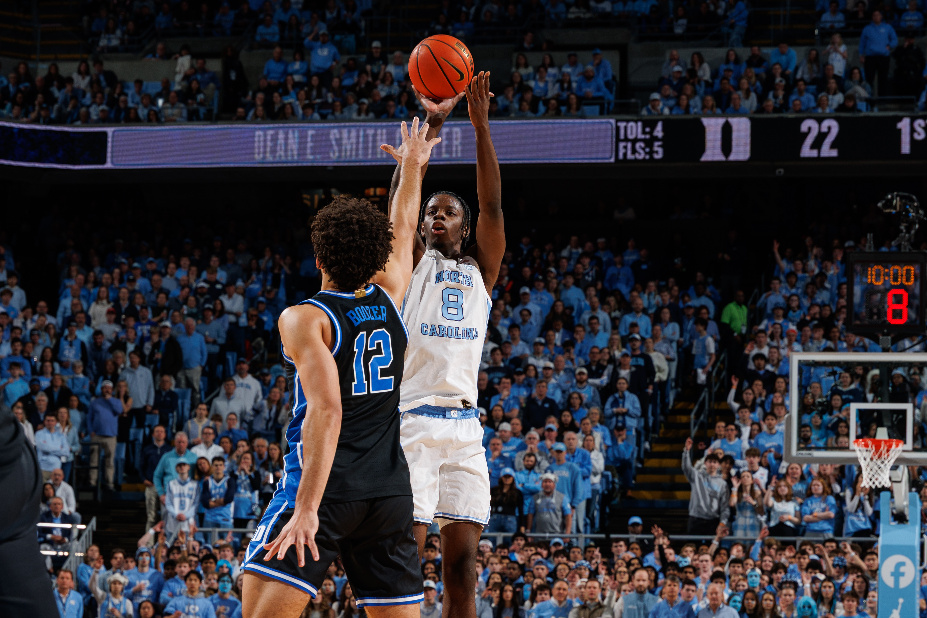 UNC's Caleb Wilson shooting over Duke's Cameron Boozer in a Tar Heel victory at the Dean Smith Center
