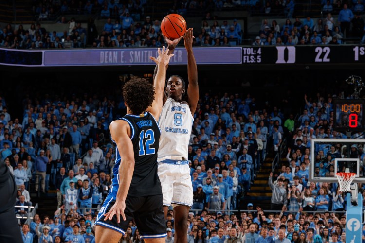 UNC's Caleb Wilson shooting over Duke's Cameron Boozer in a Tar Heel victory at the Dean Smith Center