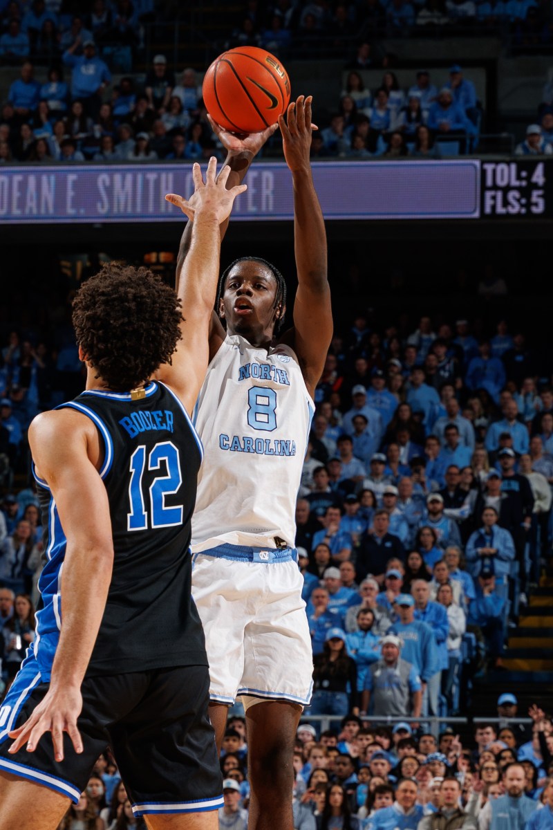 UNC's Caleb Wilson shooting over Duke's Cameron Boozer in a Tar Heel victory at the Dean Smith Center