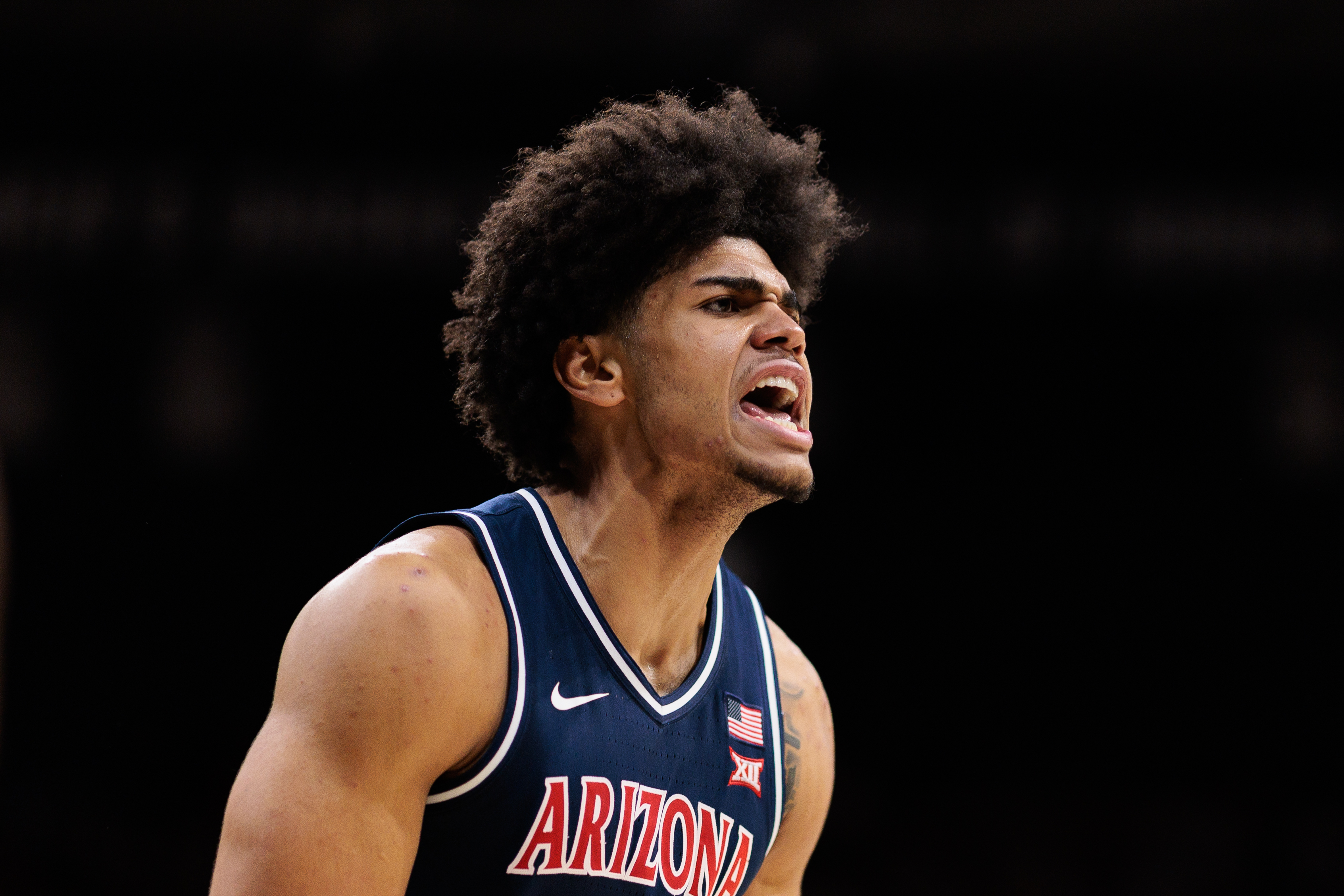 University of Arizona basketball Koa Peat yells with joy
