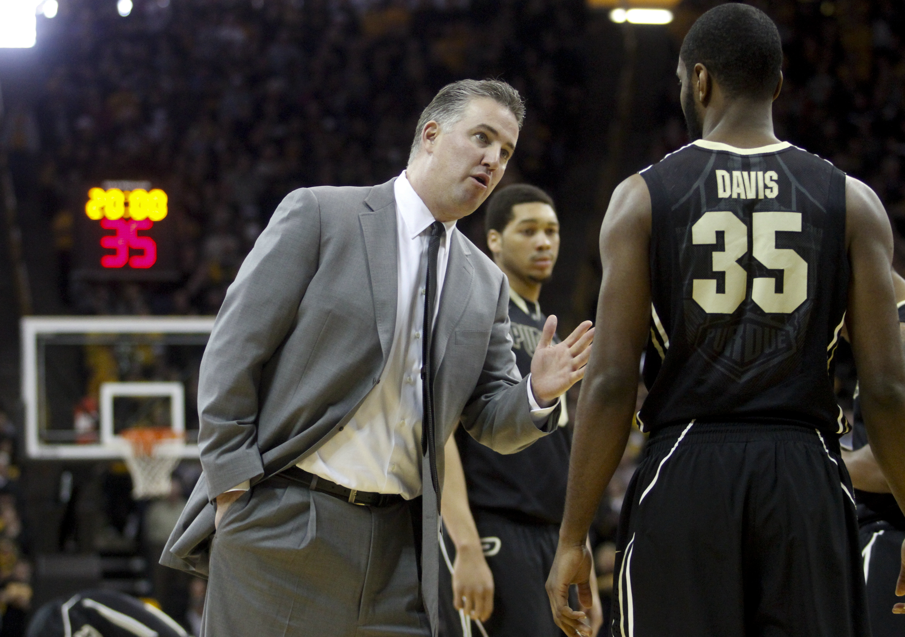 Purdue coach Matt Painter discussing strategy with Davis during his playing days