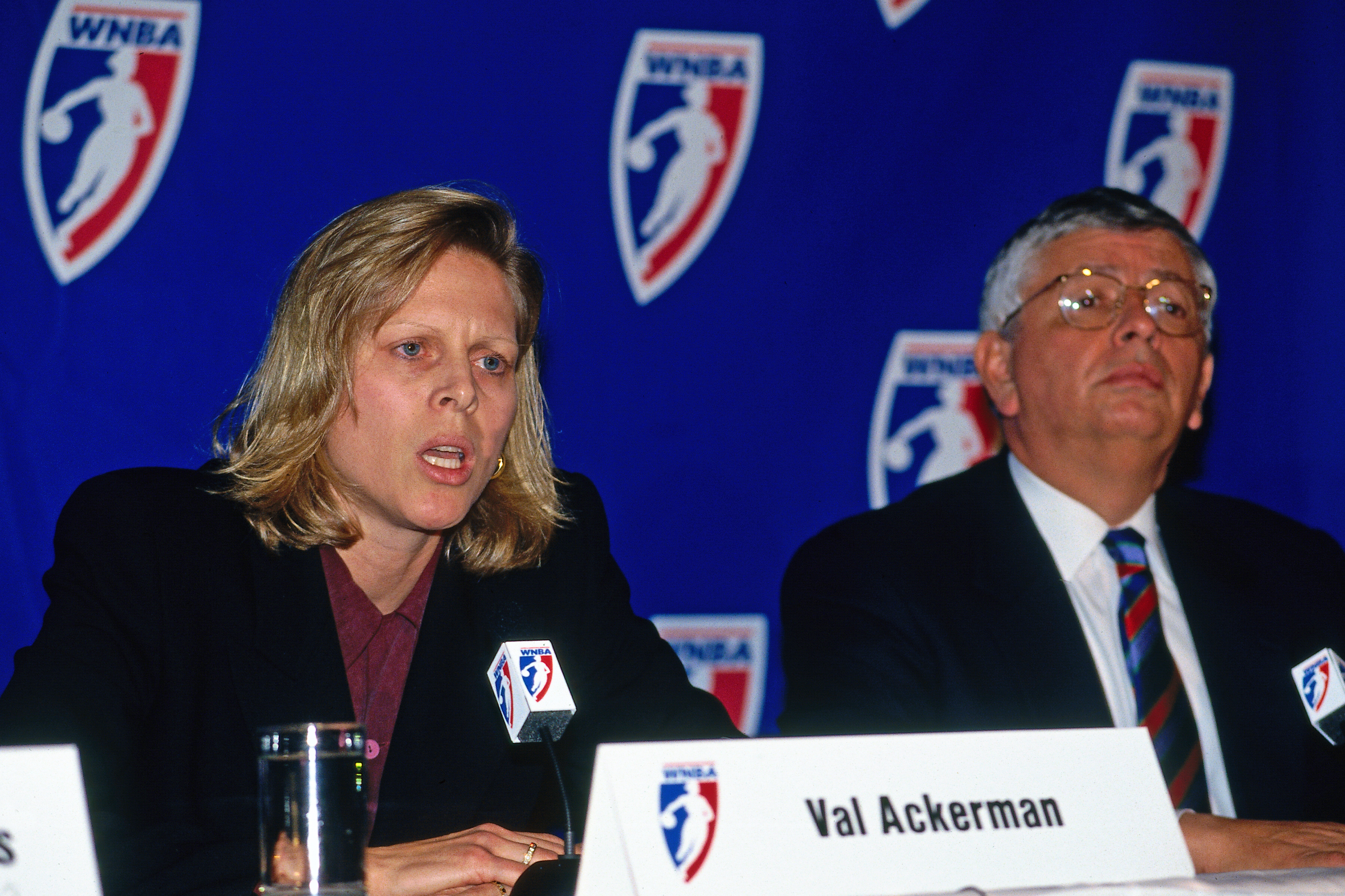 Ackerman seated next to David Stern at the 1996 press conference announcing the inaugural season of the WNBA