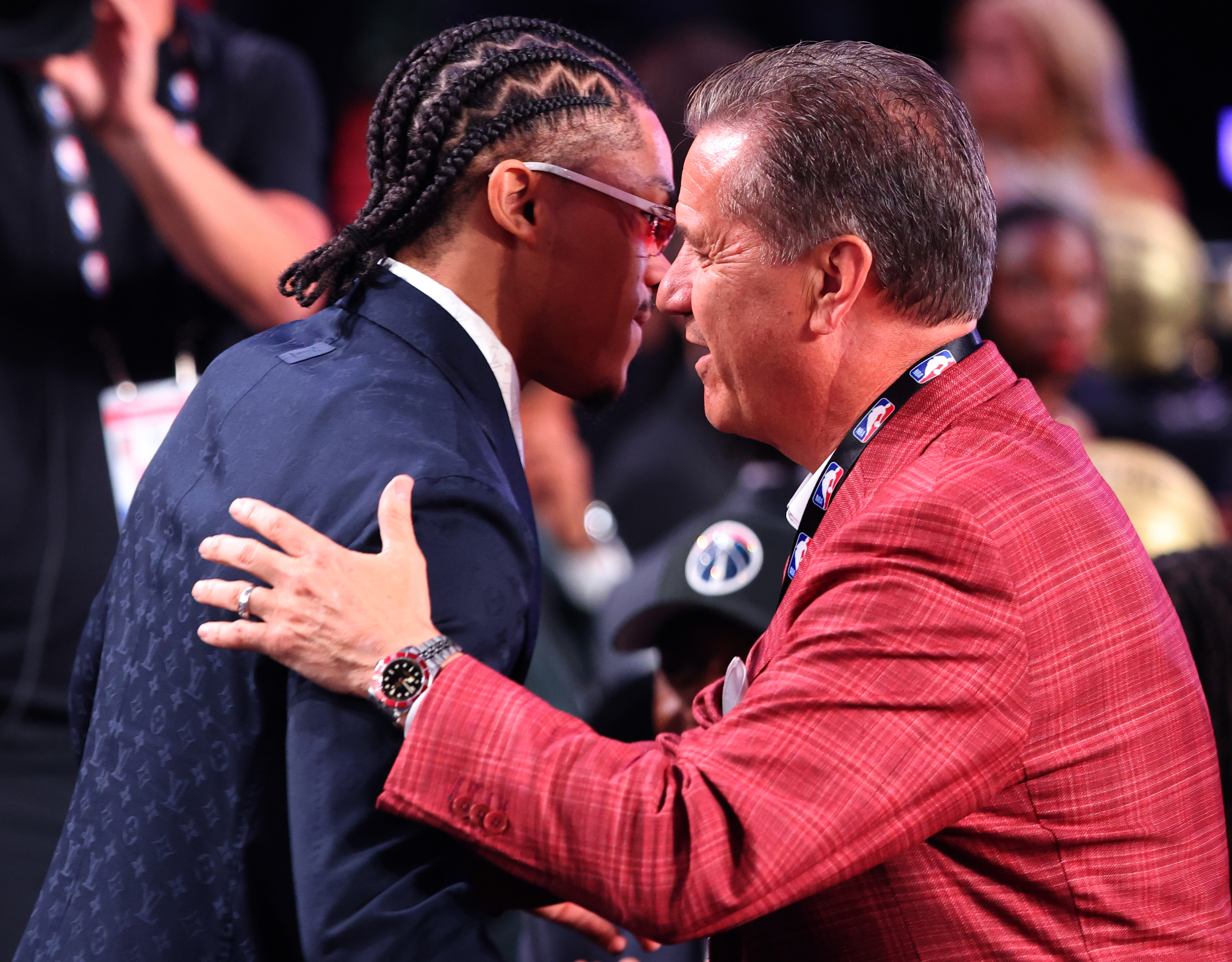 Arkansas coach John Calipari embraces Darius Acuff Jr. after his selection