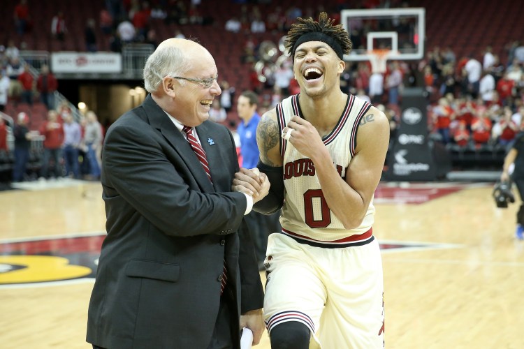Kenny Klein celebrates with Louisville great Damion Lee after a win vs. Duke