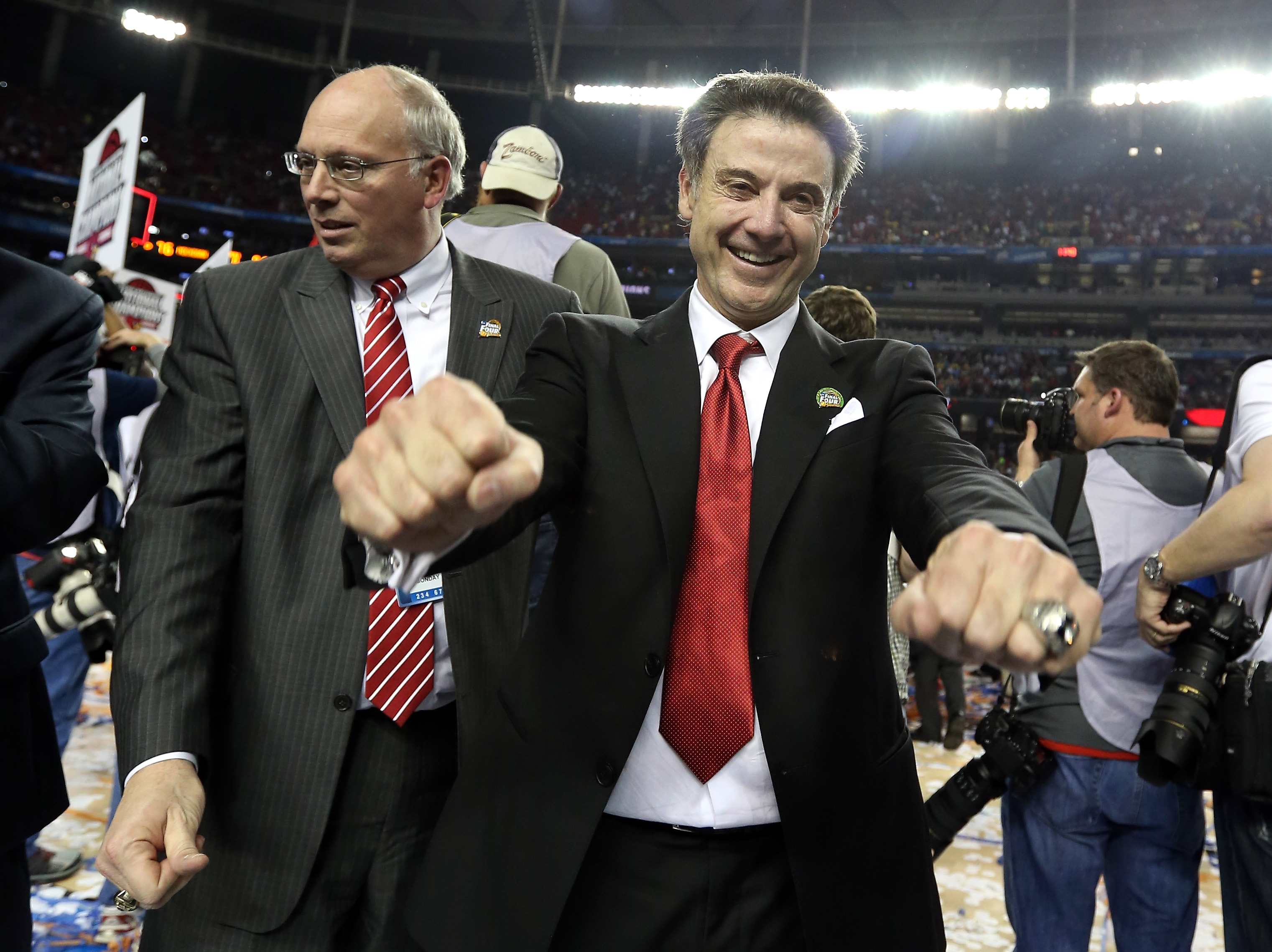 Rick Pitino and Kenny Klein celebrate after beating Michigan in the 2013 NCAA Tournament title game