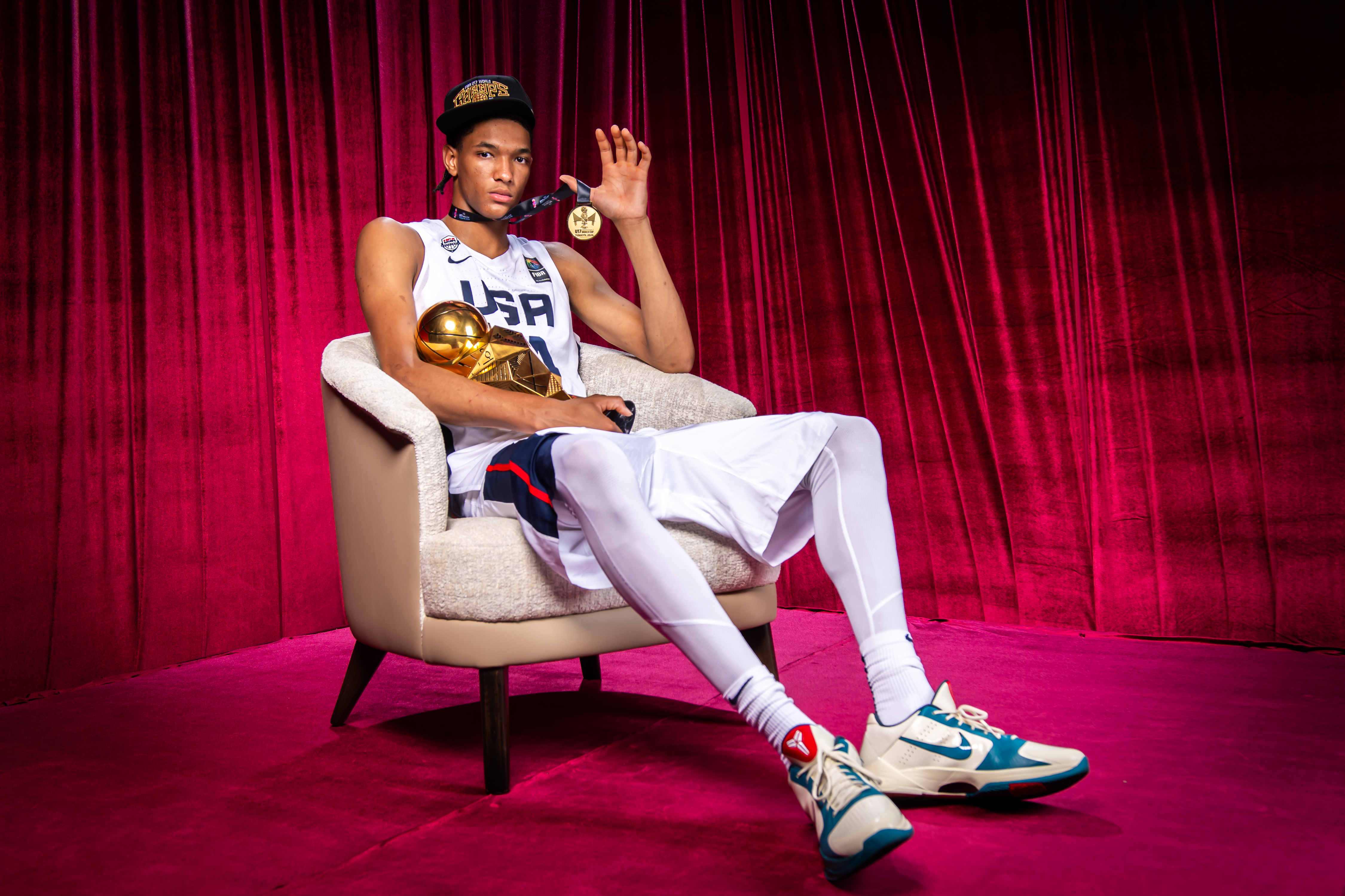 CJ Rosser poses with his medal and trophy after winning the FIBA U17 World Cup