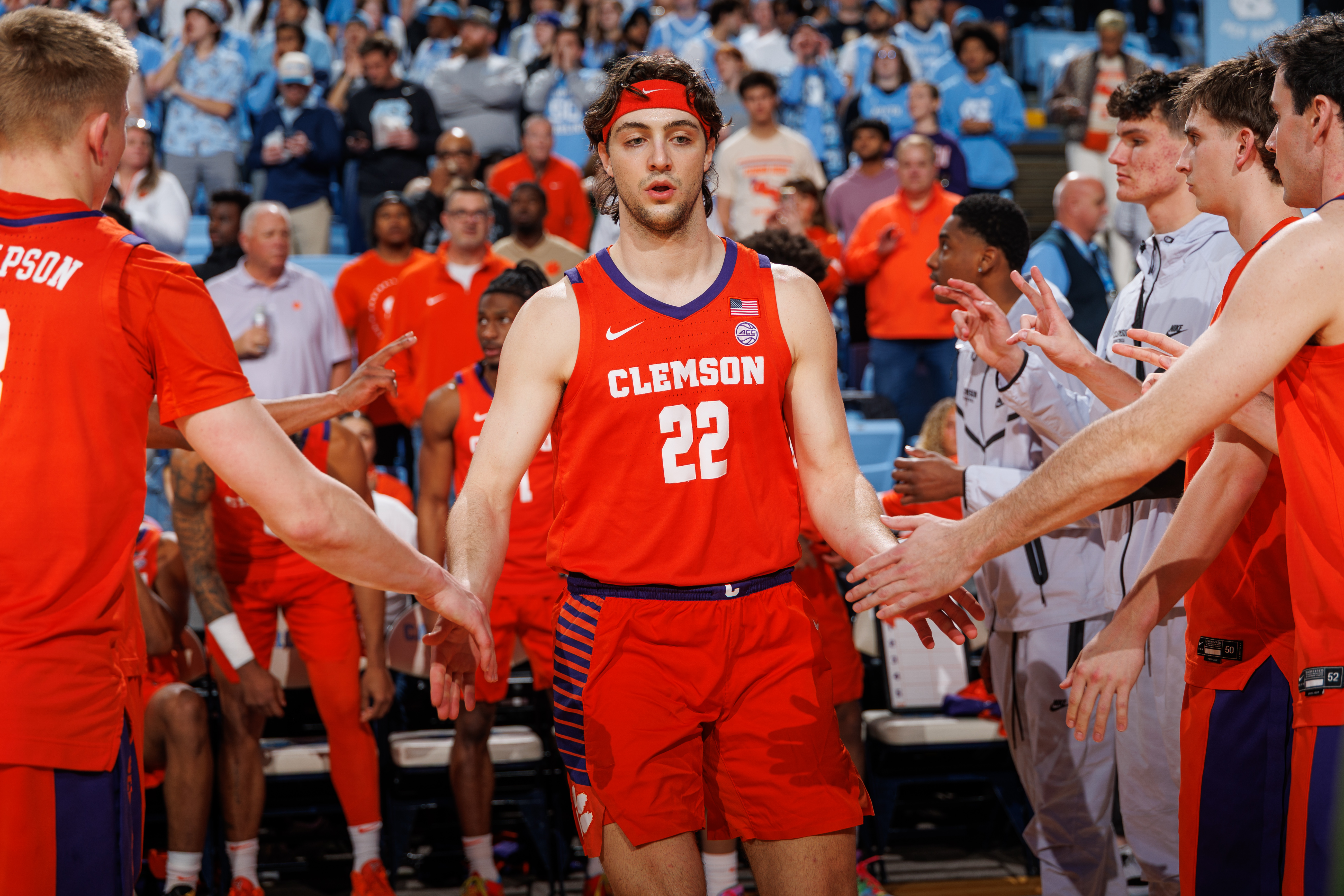 Carter Welling high fives teammates before a game against North Carolina