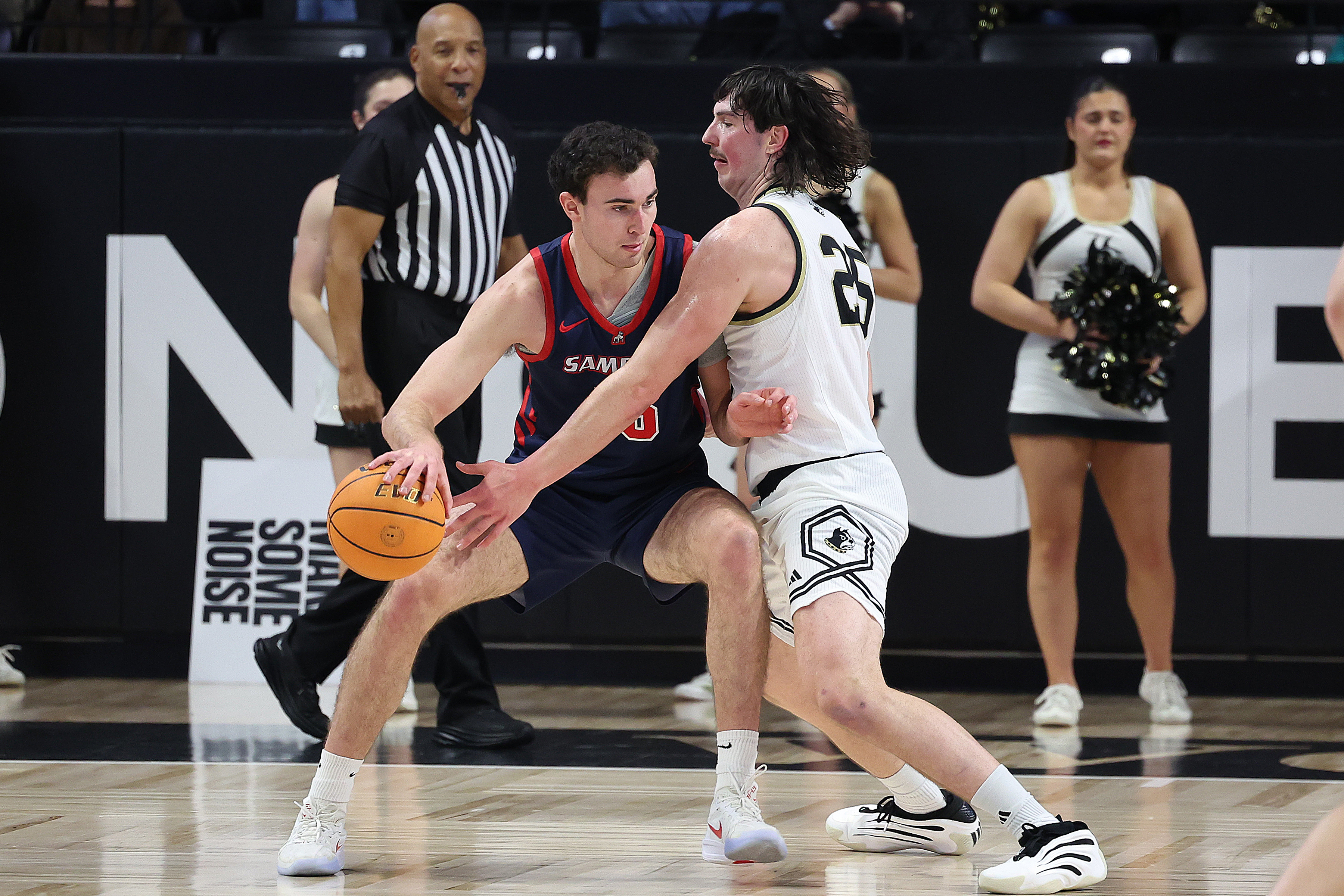 Dylan Faulkner dribbles around a Wofford defender