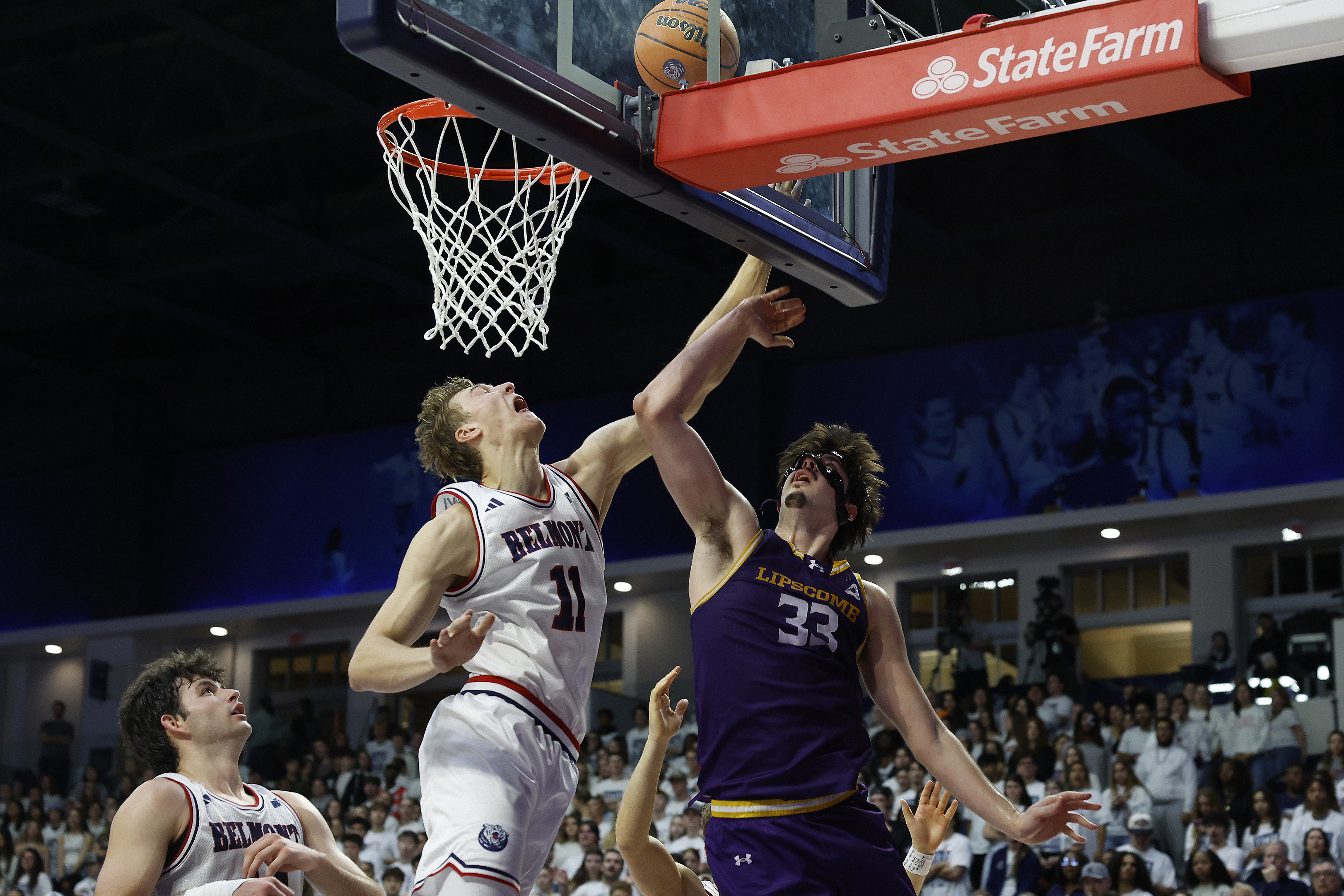 Drew Scharnowski of Belmont attempts to block a shot in a game against Lipscomb