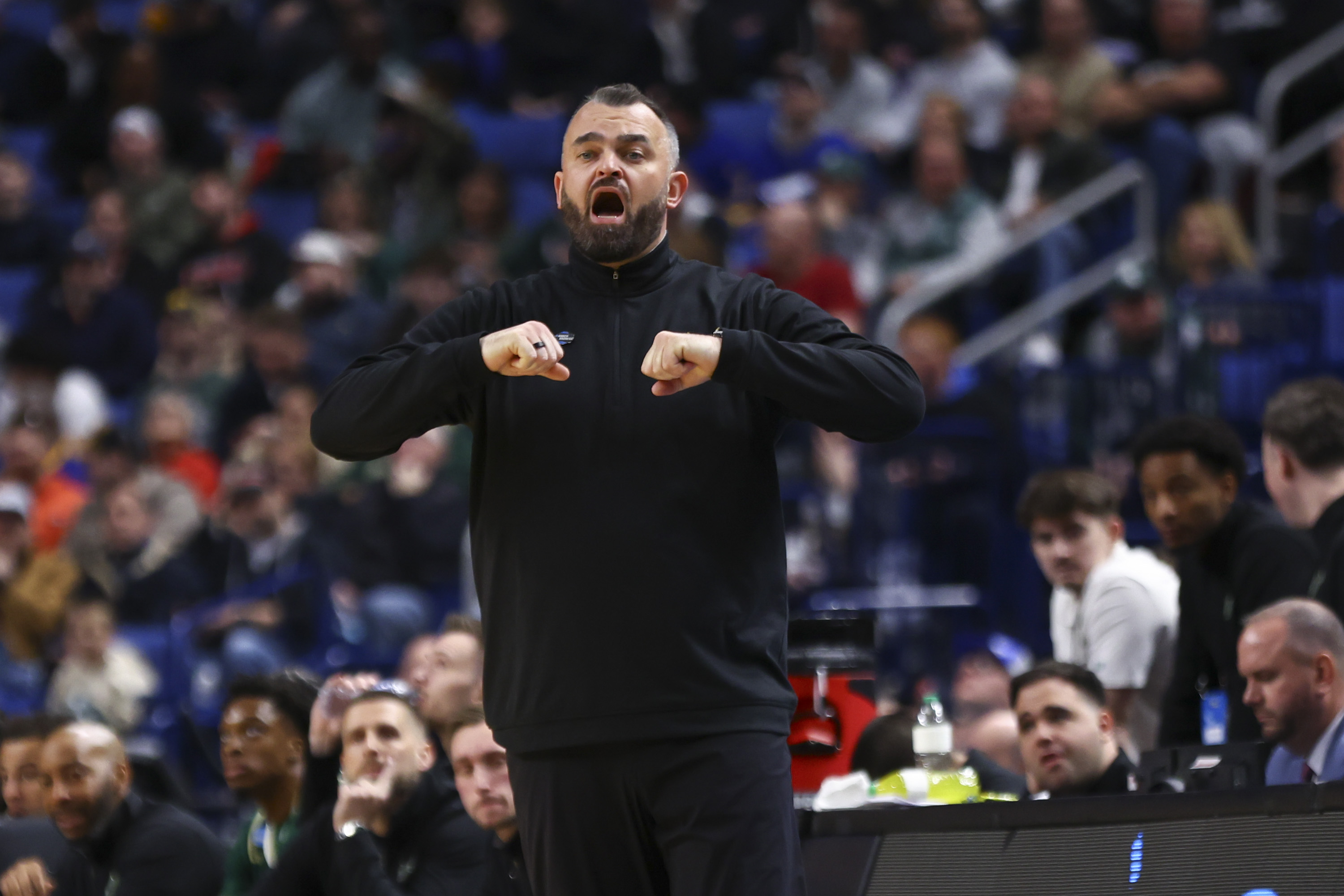 Bryan Hodgson coaching South Florida in a 2026 NCAA Tournament game against Louisville