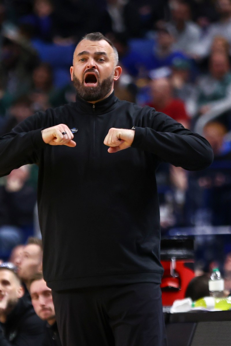 Bryan Hodgson coaching South Florida in a 2026 NCAA Tournament game against Louisville