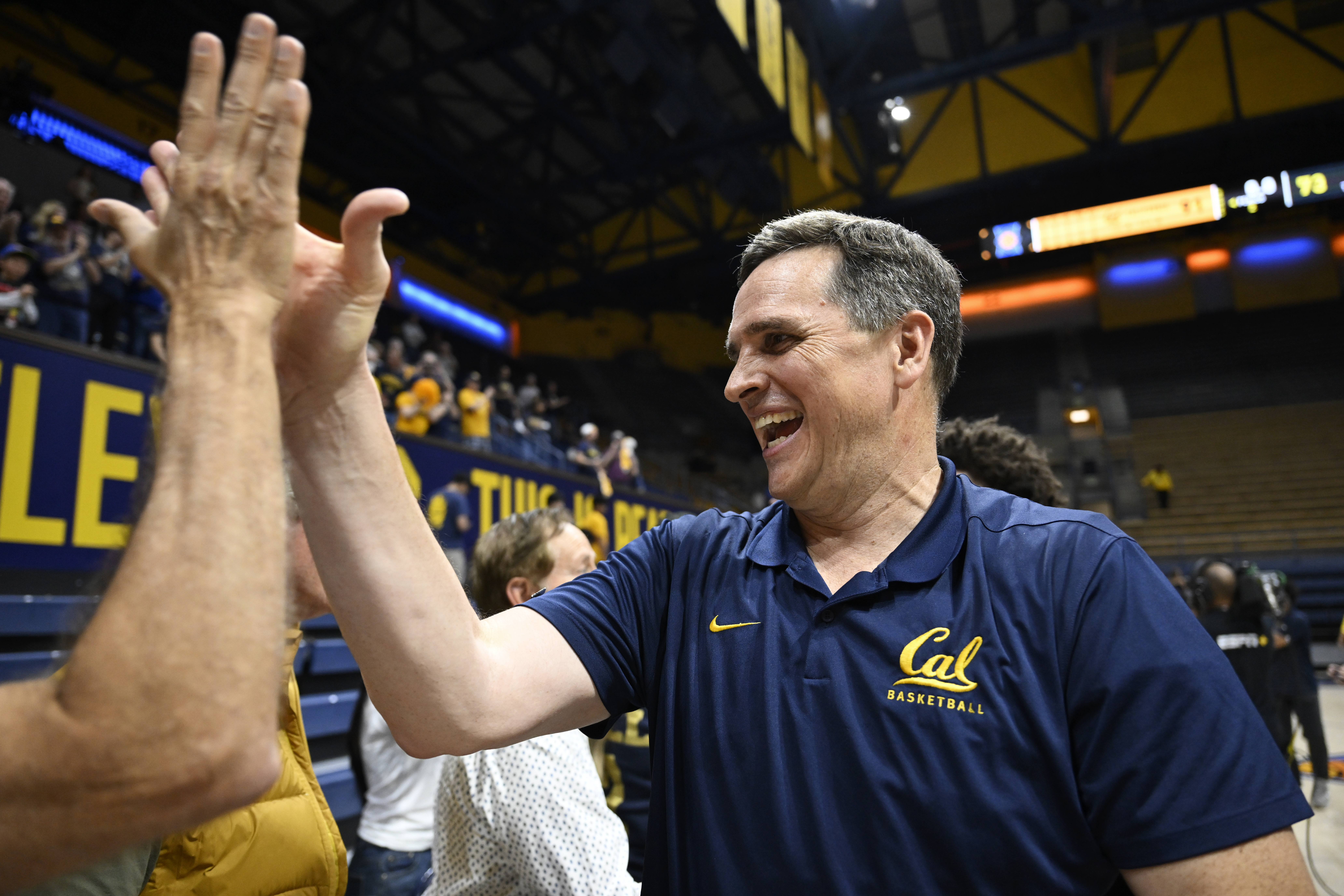 Cal head coach Mark Madsen gives out a high-five as he celebrates a win over UIC in the 2026 NIT