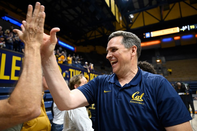 Cal head coach Mark Madsen gives out a high-five as he celebrates a win over UIC in the 2026 NIT
