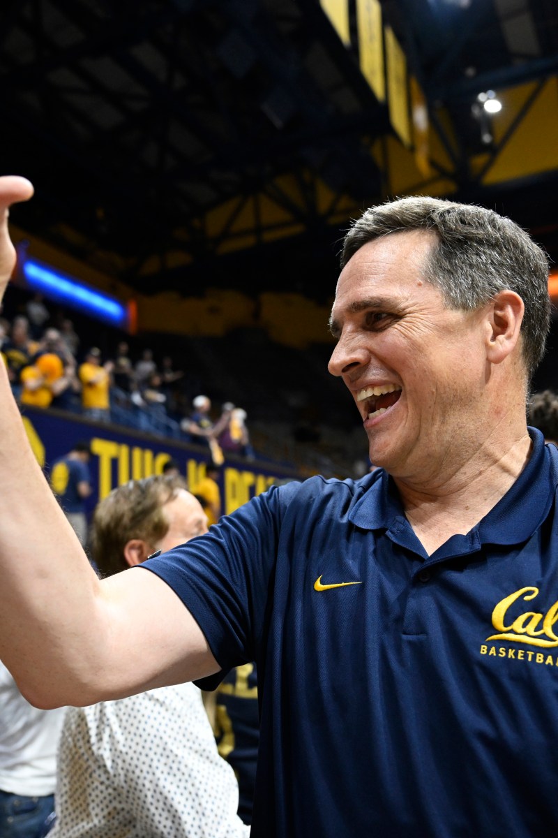 Cal head coach Mark Madsen gives out a high-five as he celebrates a win over UIC in the 2026 NIT