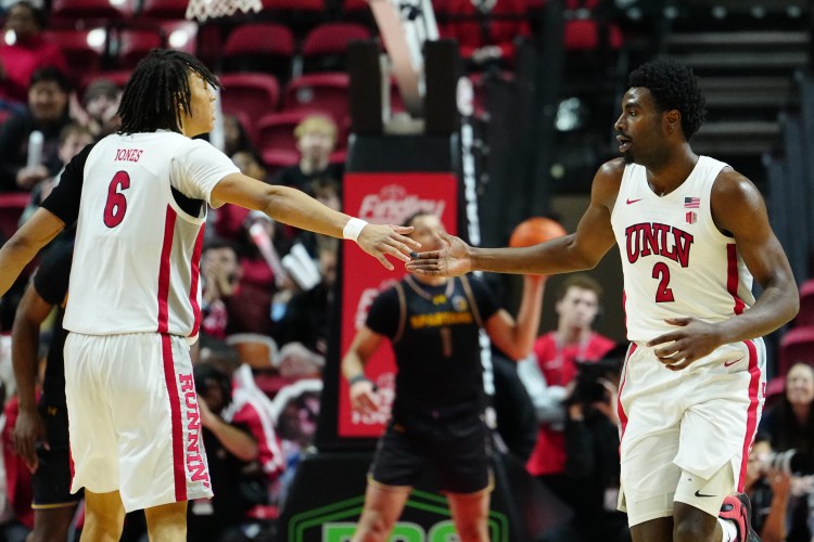 Tyrin Jones and Kimani Hamilton high-five during a game against the San Jose State Spartans