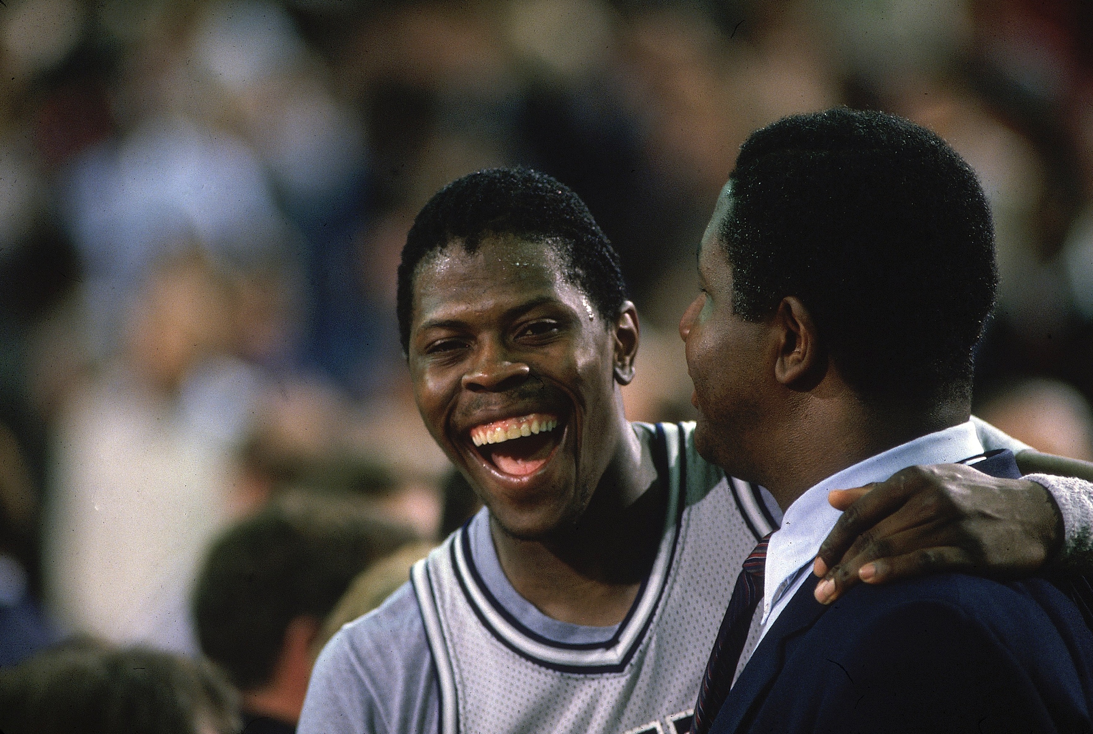 Ewing celebrates with coach Thompson after winning the 1984 NCAA championship game against Houston