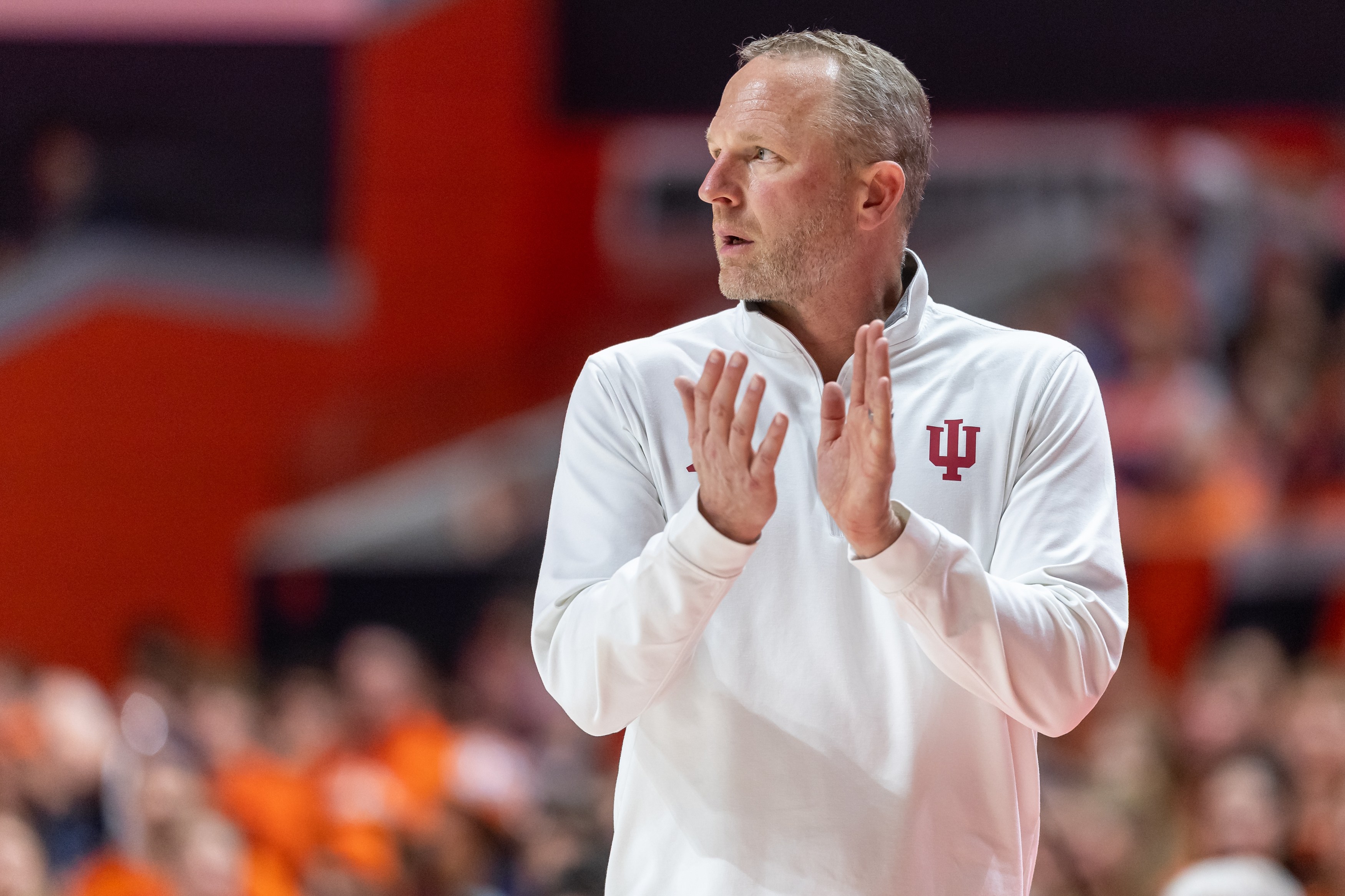 Indiana head coach Darian DeVries offers encouragement from the sidelines